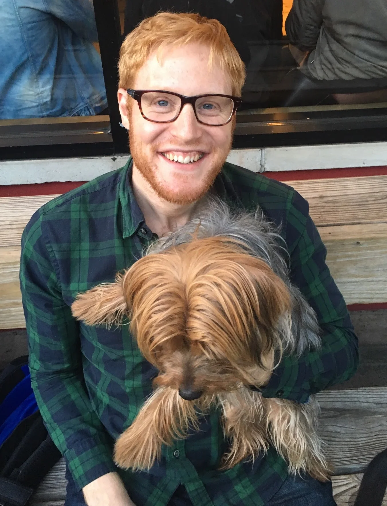 Ben Fogelson with his dog Frida. She's looking for bits of taco on the floor.