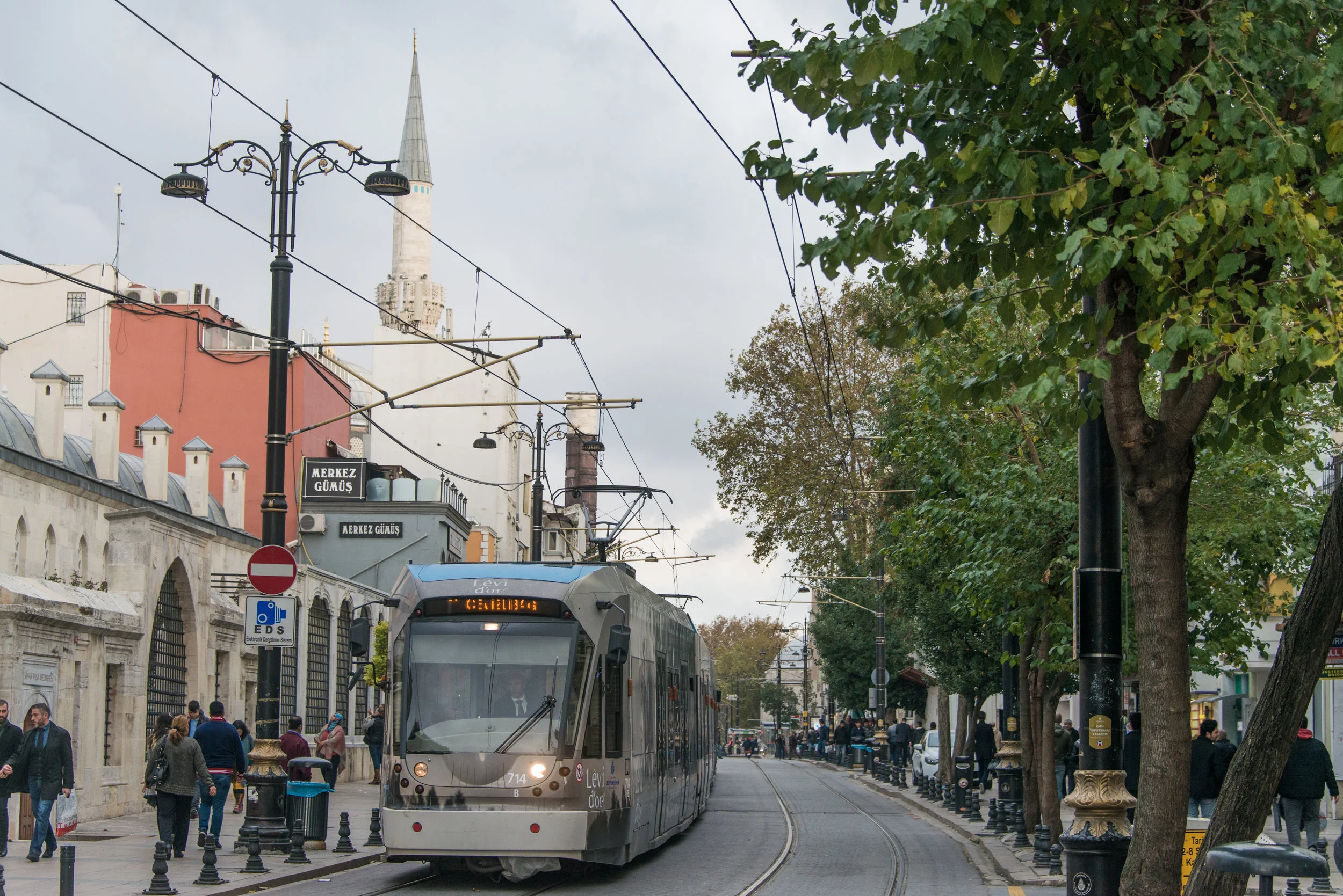 Tram Driving Along Beyazit - Column of Constantine Can be Seen in the Background - Istanbul - Nov 2017