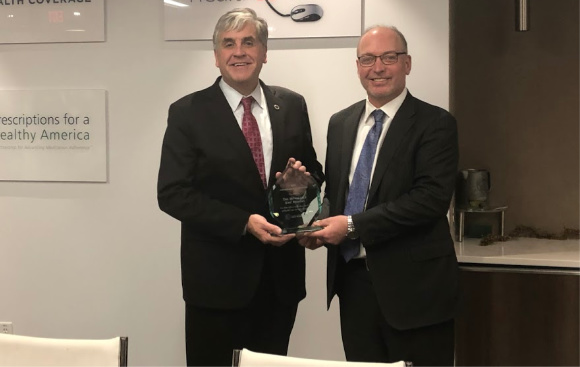 HHS Deputy Secretary Eric Hargan (left) receives CAHC's 2018 Affordability Champion Award from CAHC President Joel White (right).