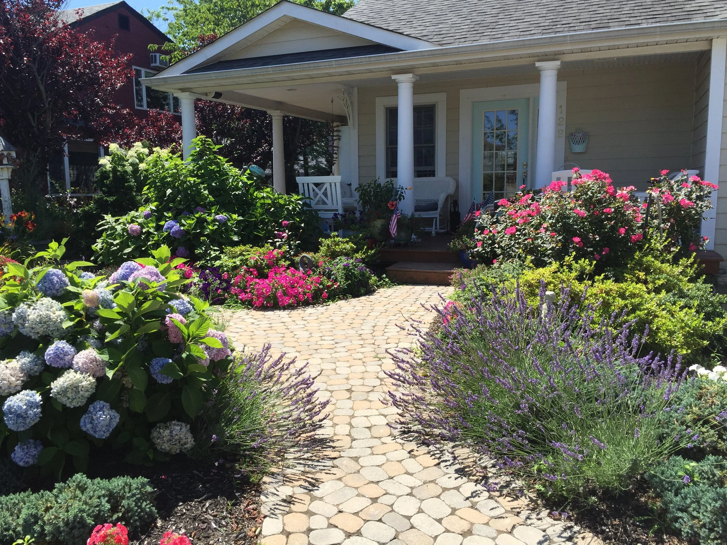 Landscape design with natural stone walkway in Long Island, NY​​​​​​​