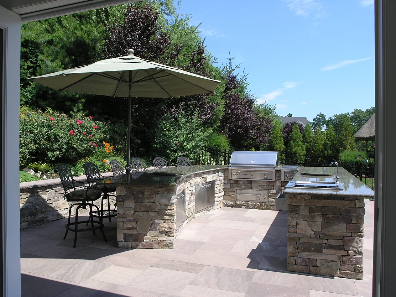 Landscape design with outdoor kitchen in Long Island, NY​​​​​​​