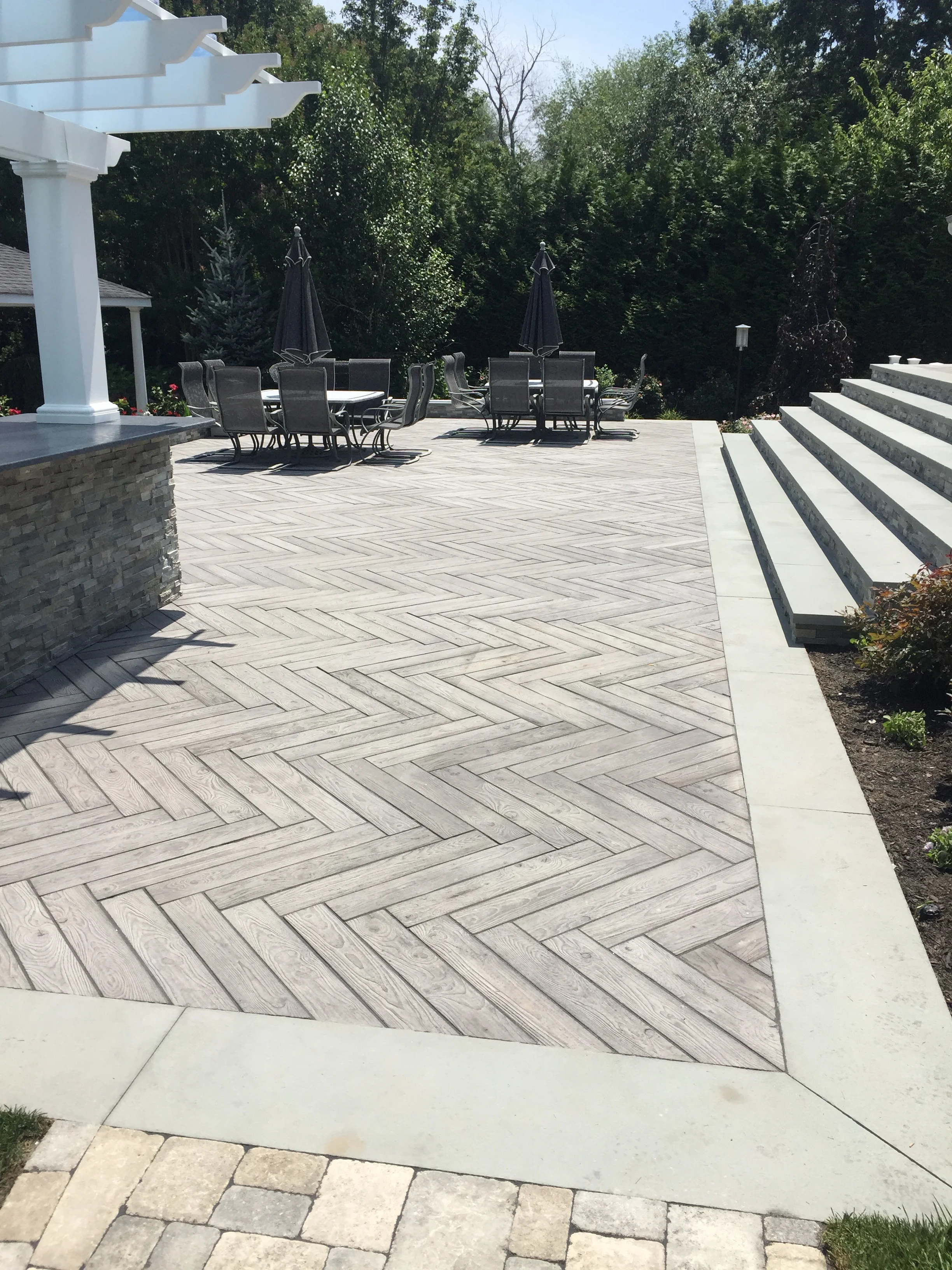 Landscape design with paved patio in Long Island, NY​​​​​​​