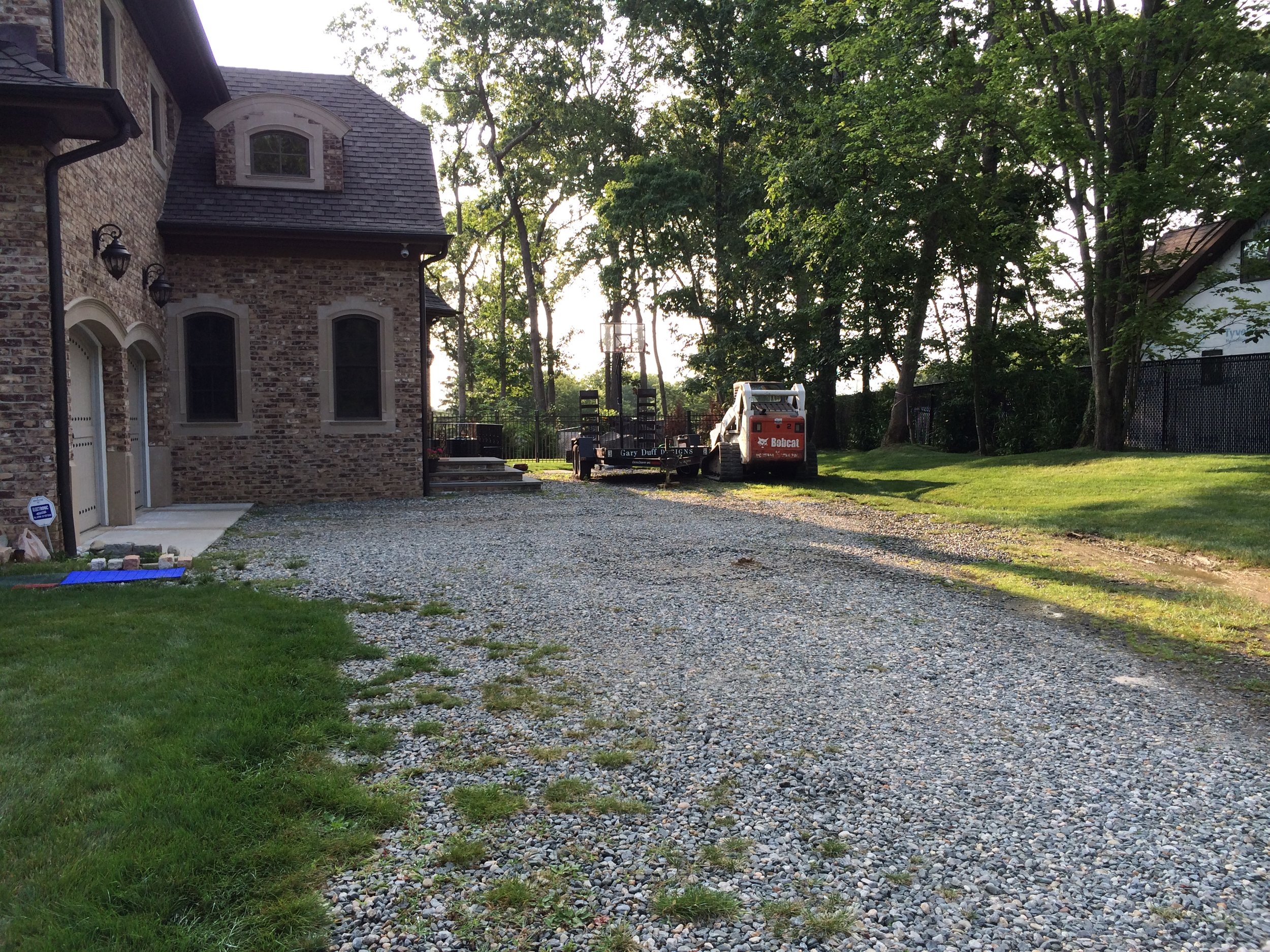 Landscape design with natural stone driveway in Long Island, NY