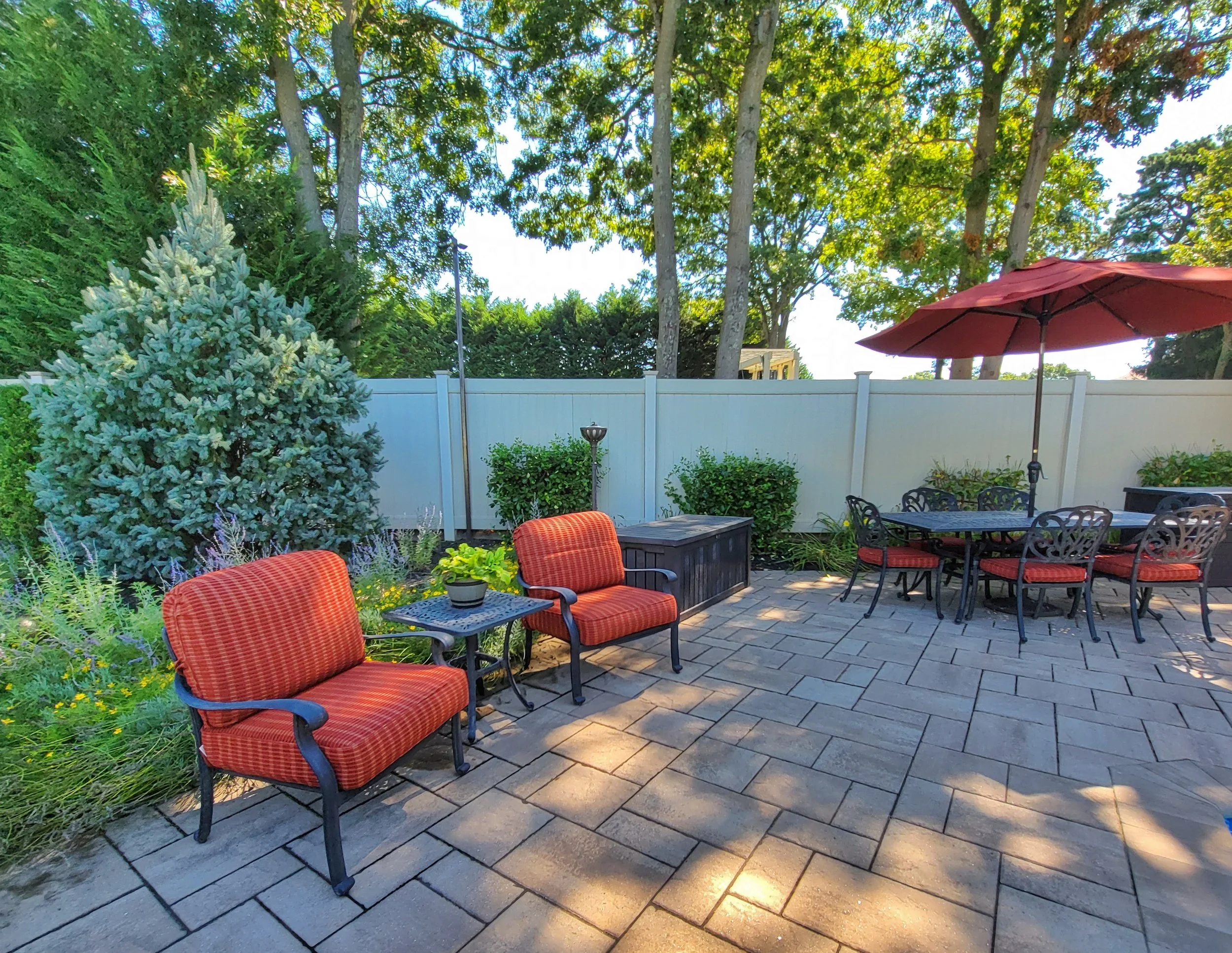 A Guide to Harmonizing Patio Designs With Landscape Design in Brookville, NY