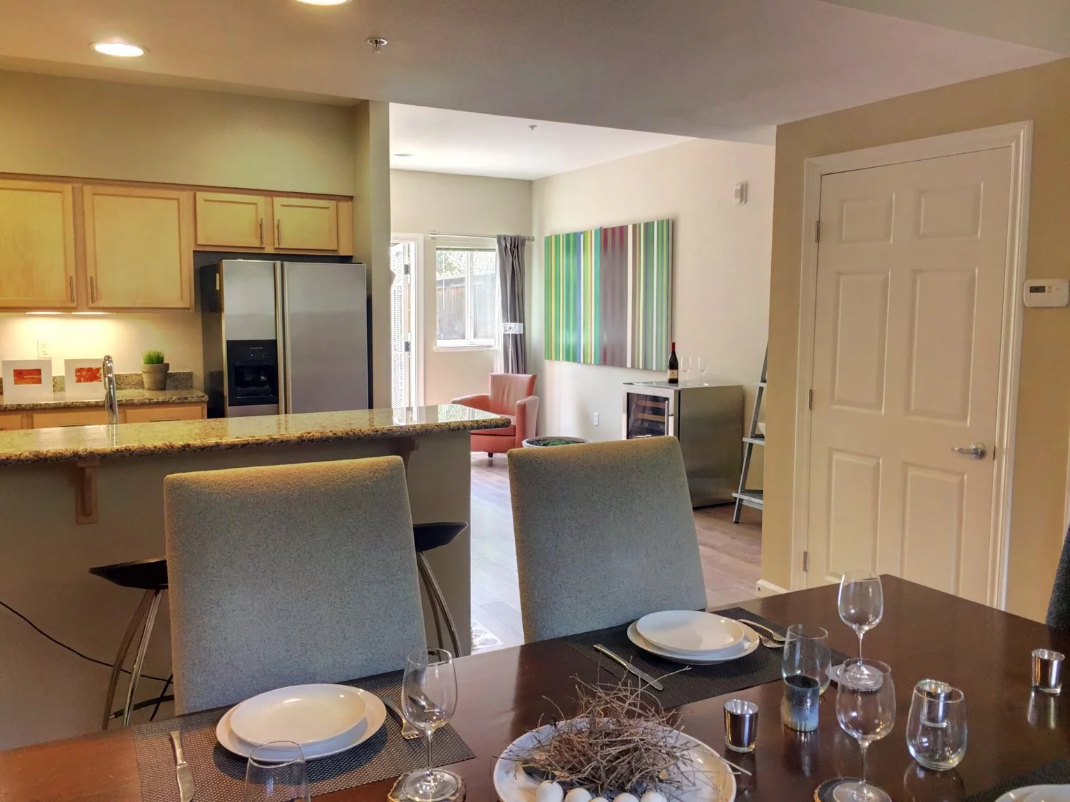 which flows into kitchen.