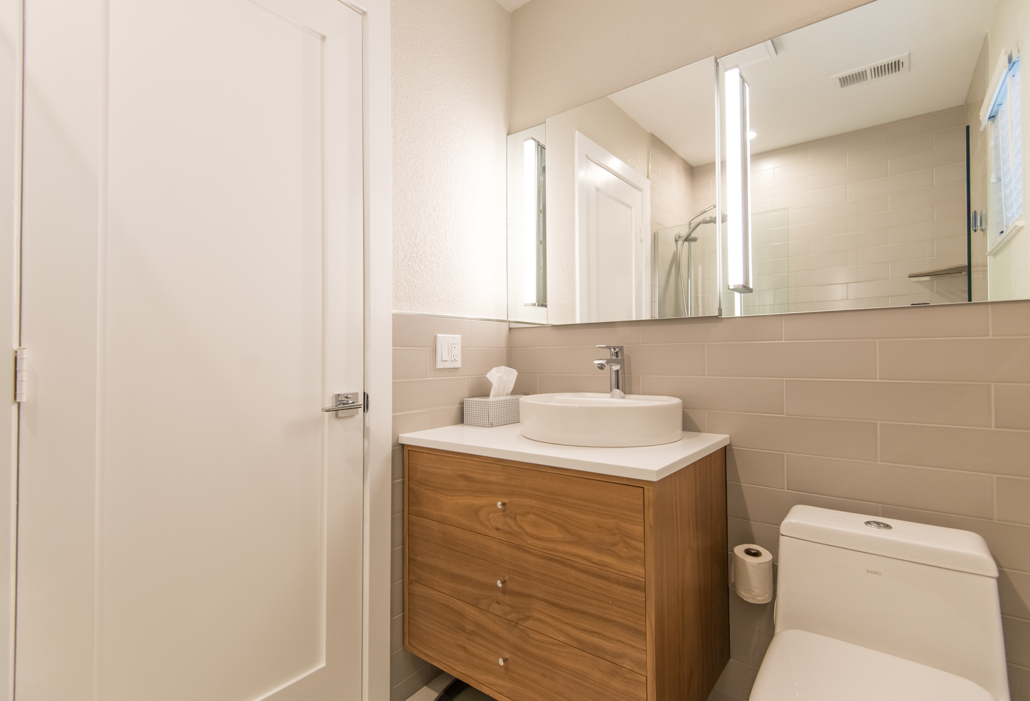 Second bath features new cabinets, Corian countertops and high-end fixtures.
