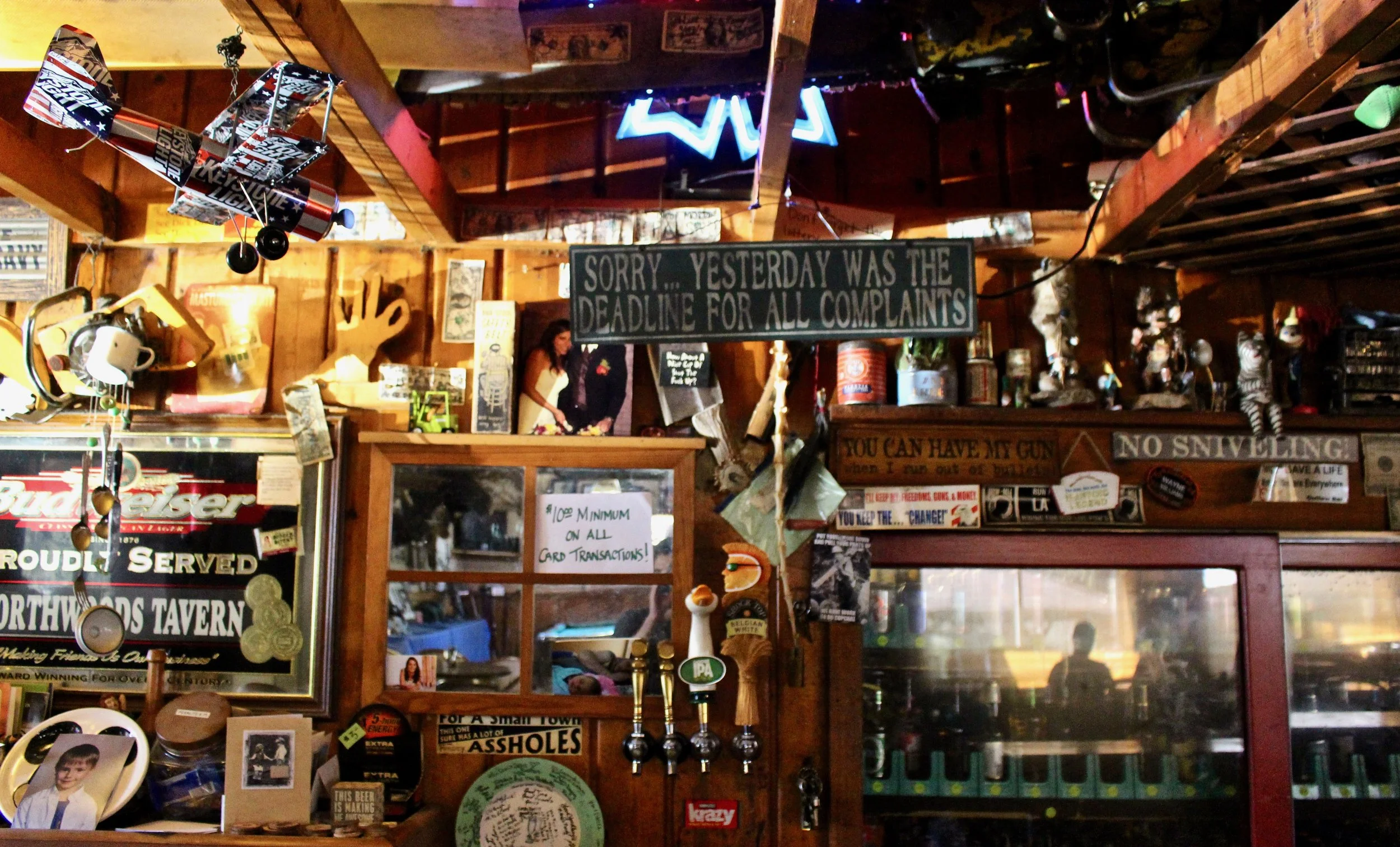 The wall behind the bar is littered with curio