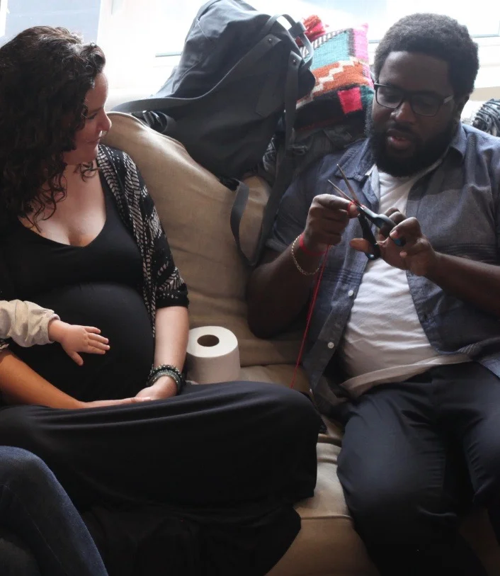 Angela at her Mother Blessing with friend Tyrone and baby Betty giving the baby-to-be some love