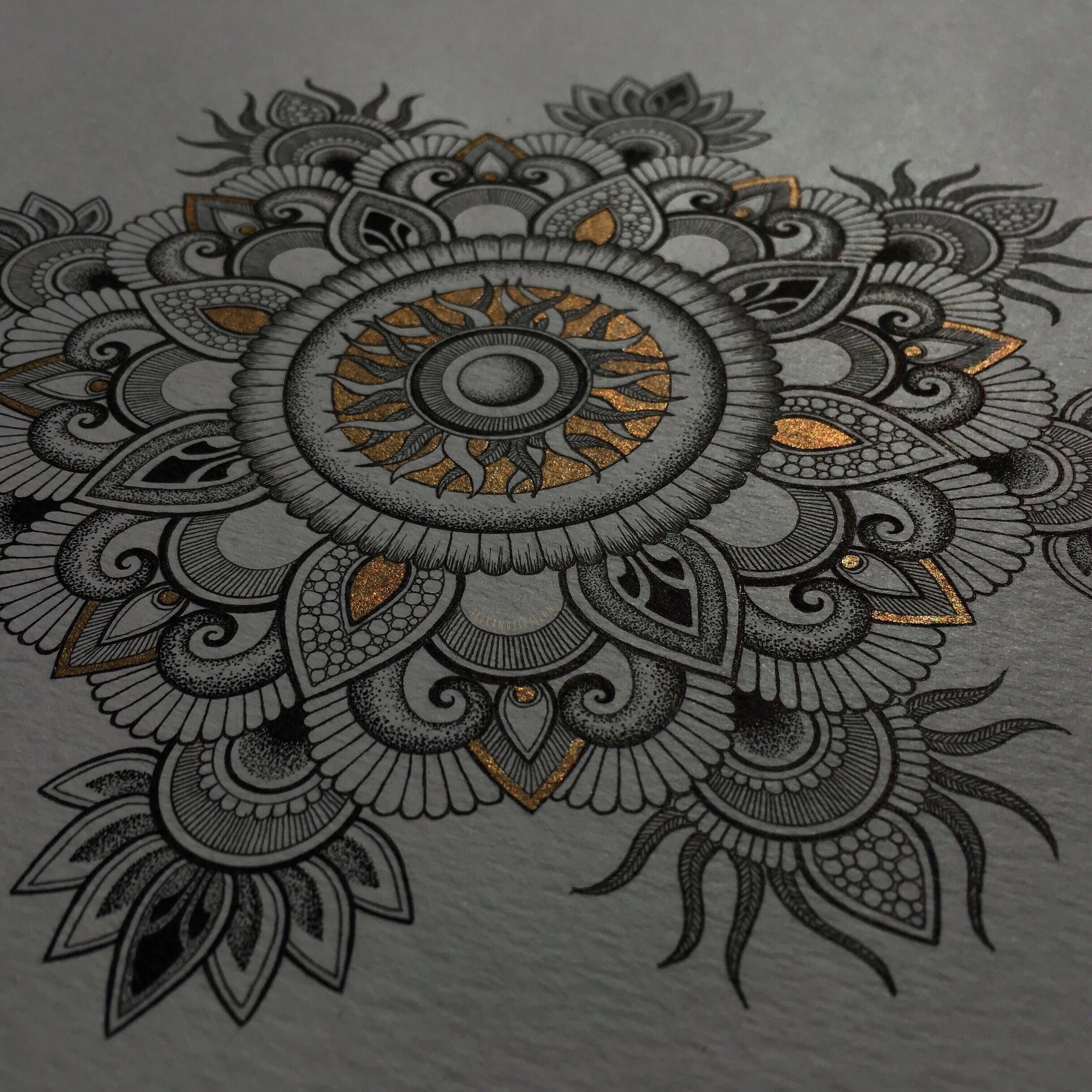 intricate mandala detail with sparkling gold accents