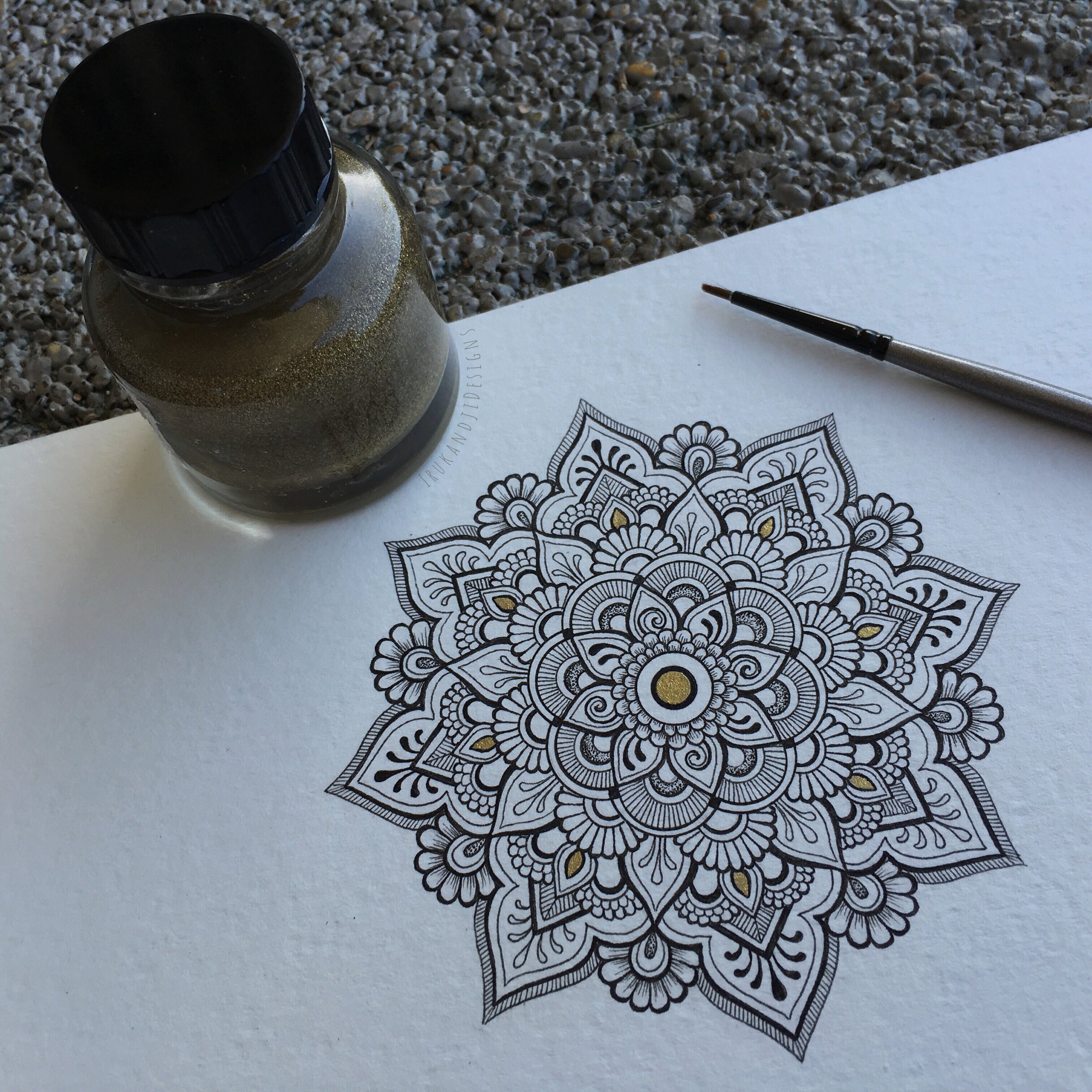 henna/mehndi style mandala with gold paint accents