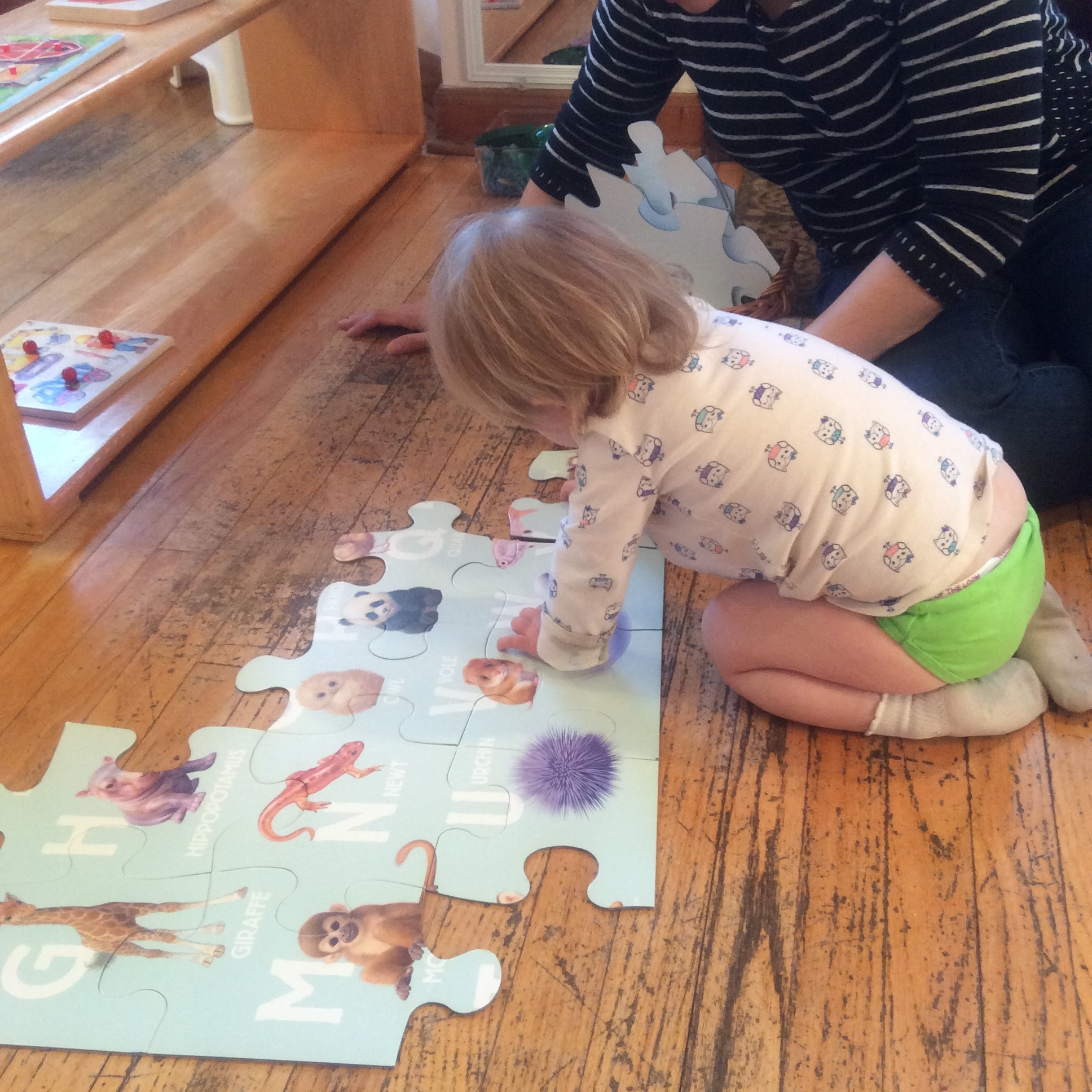 This young toddler, 18 months old, is in the early stages of toilet training.