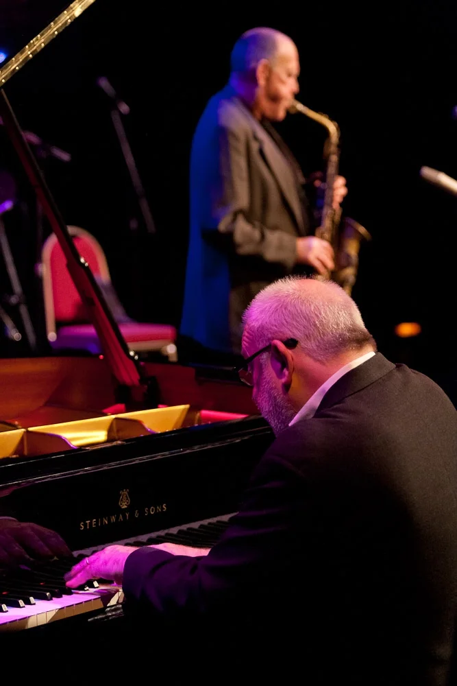Paul Grabowsky at the piano, with Bernie McGann in the background