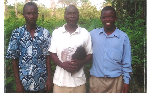 From left to right: Abraham (the pastor of the Harbel church), David Bweh, and Emmanuel.