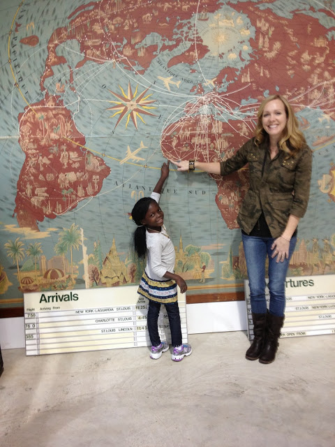  Eve and her mommy in the US, pointing back to where it all began. 