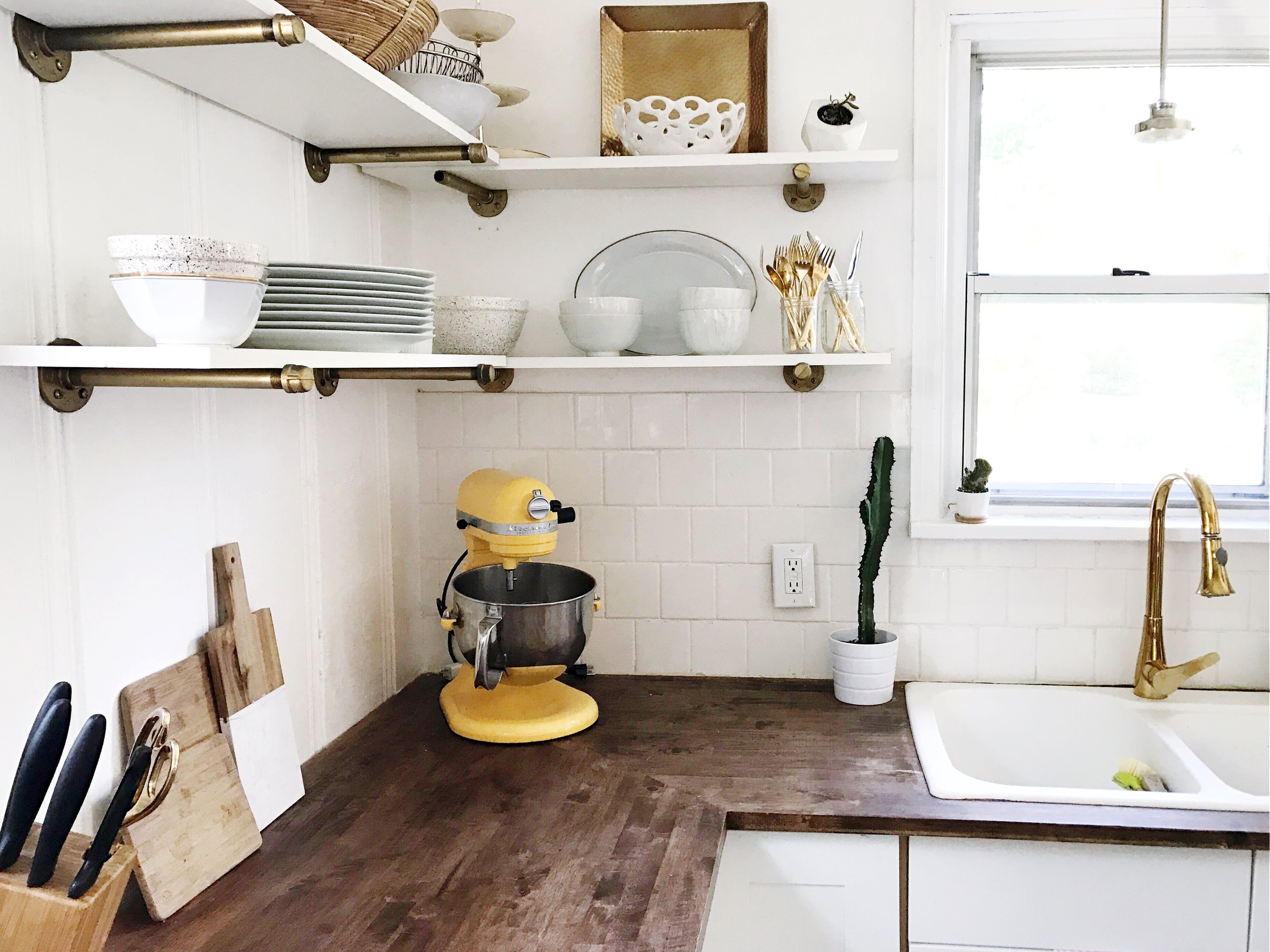 For our countertops we decided to go with butcher block. It only cost around $220, and is extremely durable, and the stain we chose created the perfect amount of debth to the room. We are super happy with them!