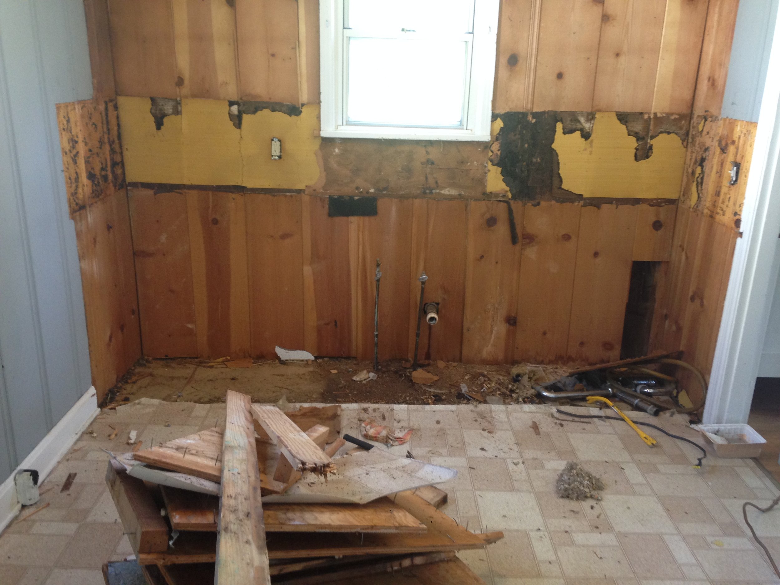 Our entire kitchen was "knotty pine" which is incredibly tough to work with. We ended up ripping it down and replacing this wall with dry wall so we could add some texture with square subway tiles. 
