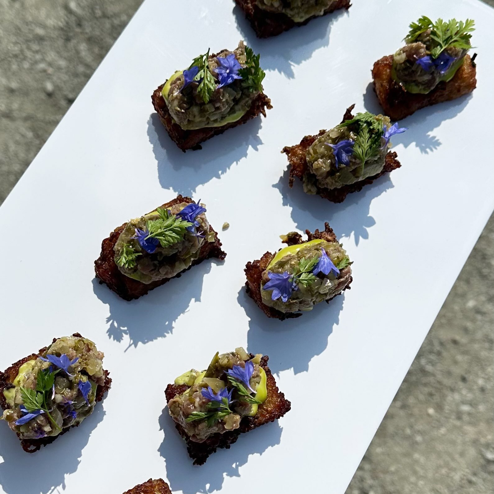 Steak tartare, but make it canape 💫

Crispy potato rosti, tarragon aioli, beef tartare, gherkin, caper &amp; corn flower for good measure.

That&rsquo;s a wrap on a wildly busy, wildly fun summer of weddings, corporate bbqs, happy hours and all of t