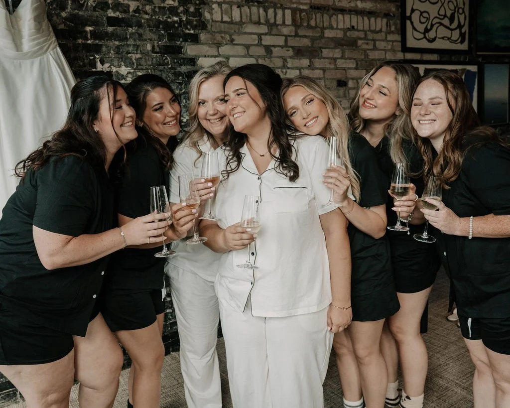 Bride getting ready with bridesmaids at Oxford Exchange wedding venue in Tampa, FL