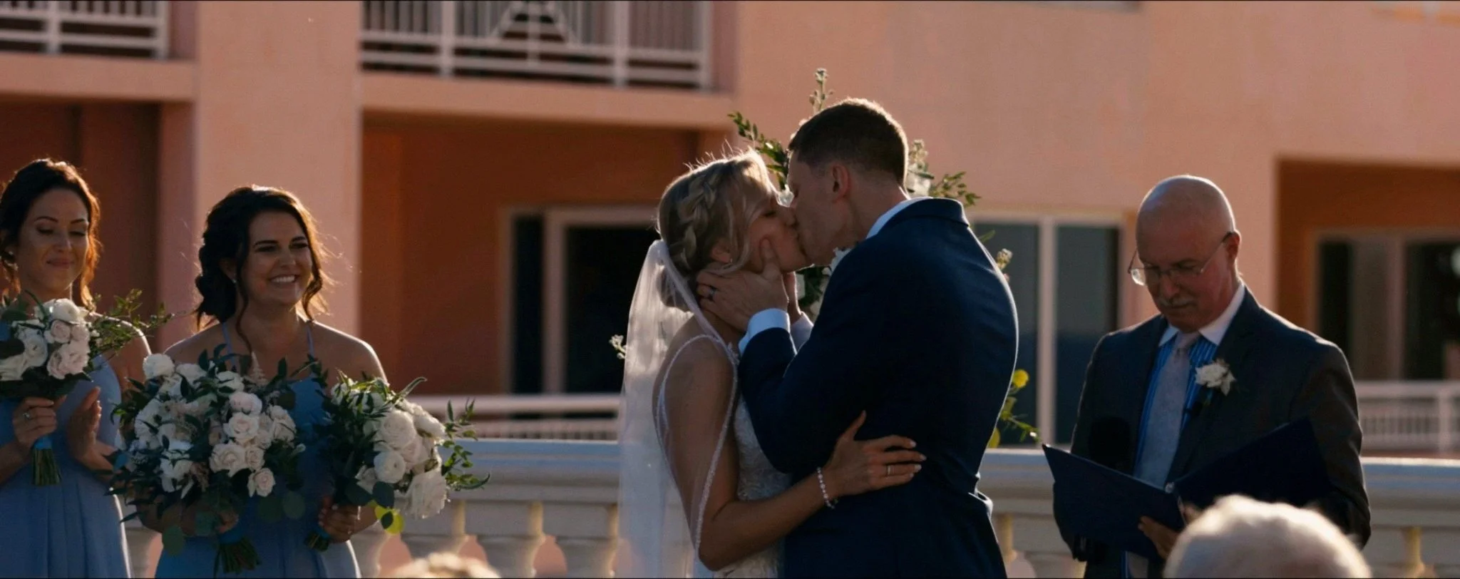 Couples first kiss as husband and wife and Hyatt Regency Clearwater Beach.