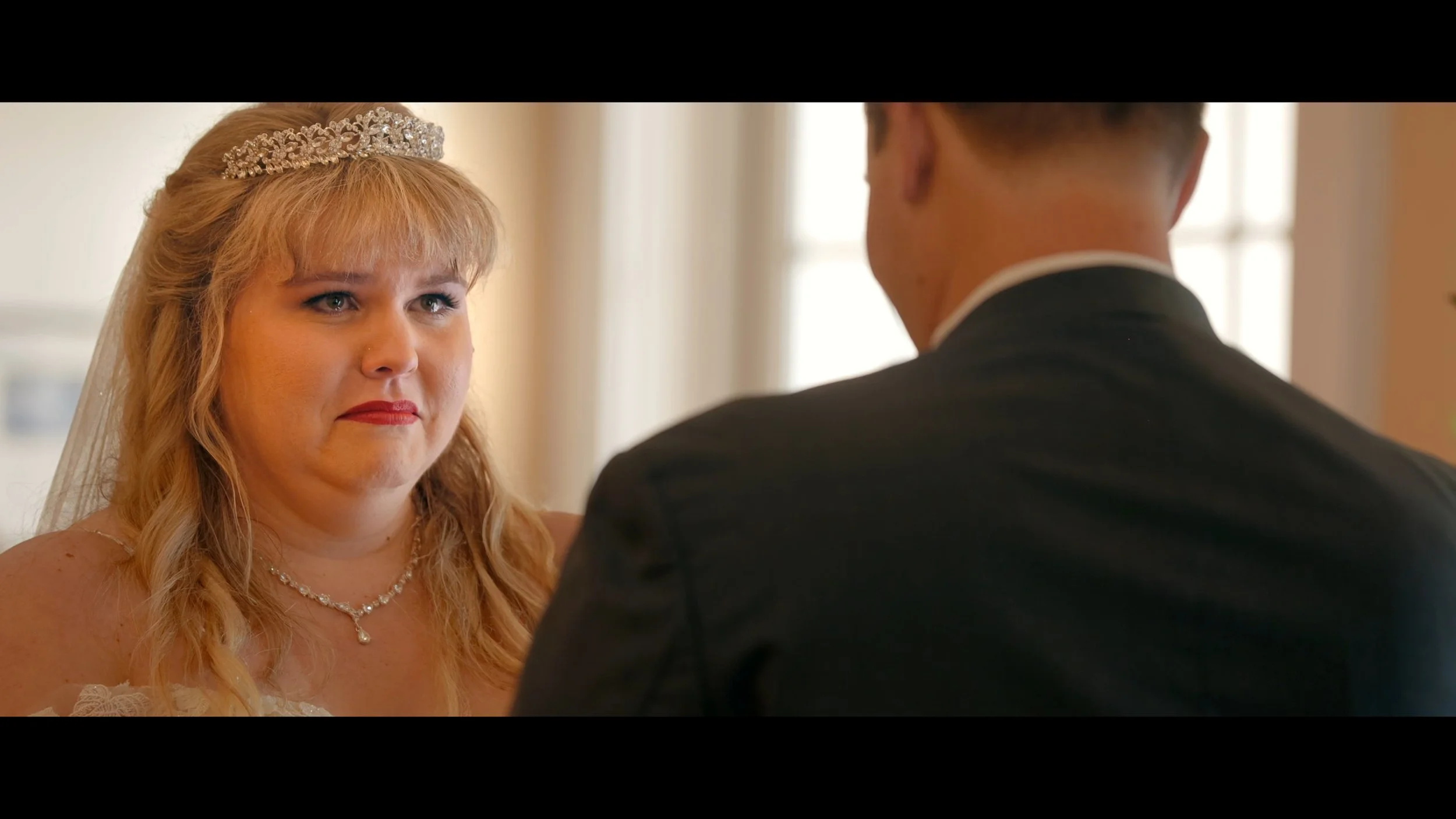 Bride listens to her grooms vows at The Regent in Riverview FL