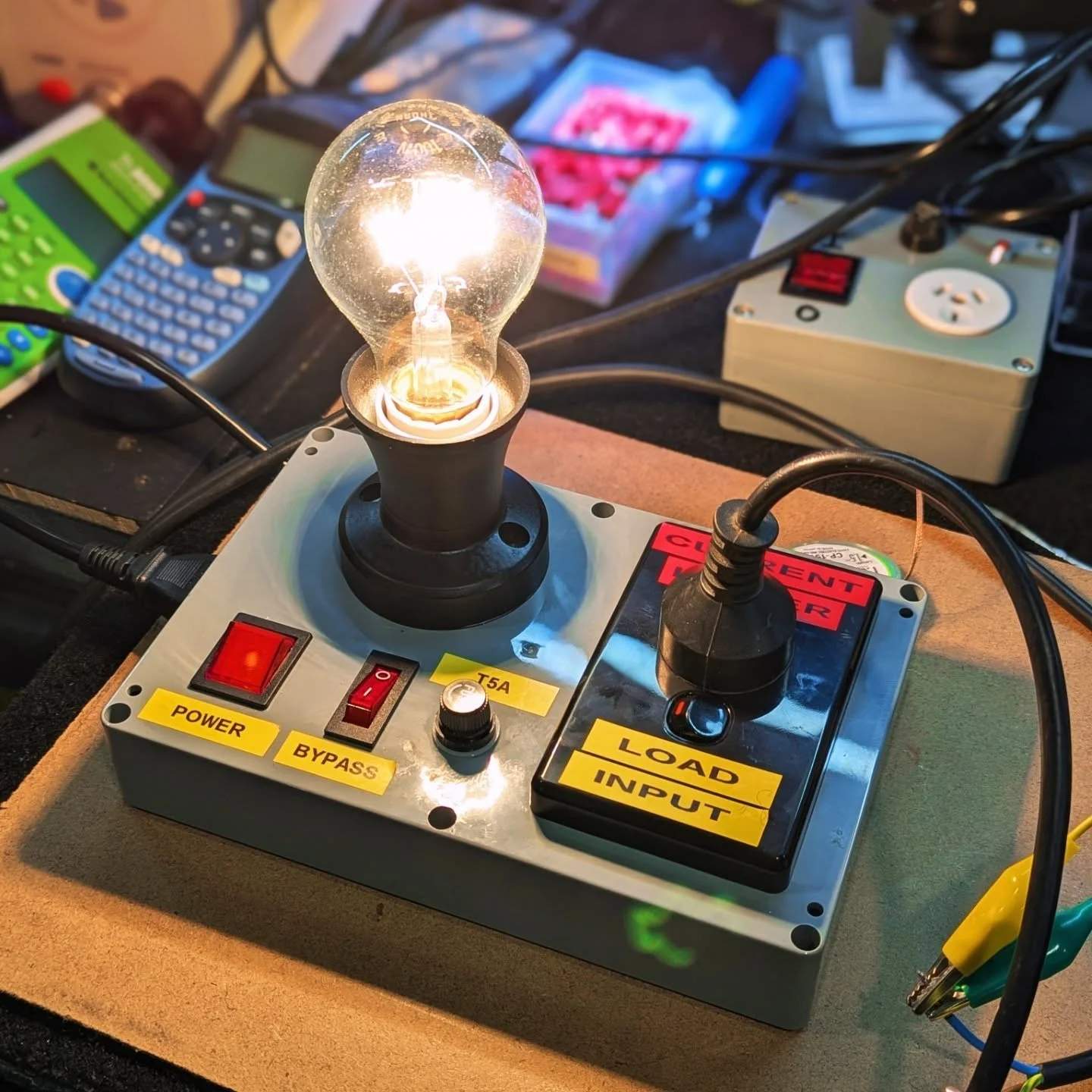Finally got round to building a Bulb Current Limiter for the test bench. Had been using a combo of a Variac + AmpMeter together beforehand. This device runs in series before the amp.
.
If there's a fault causing excessive current draw, the 100W Bulb 