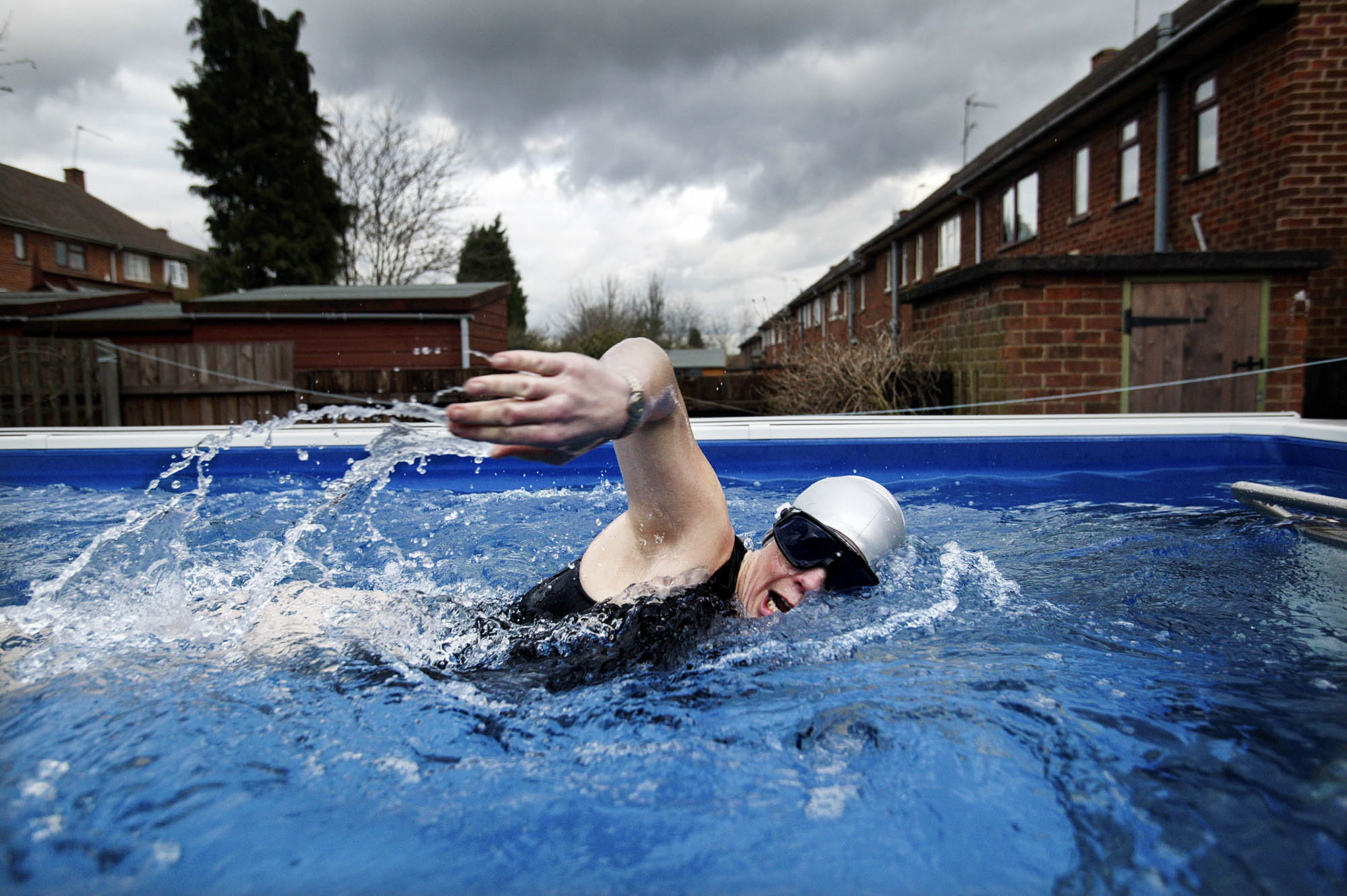 Long distance swimmer Julie Bradshaw training in her "treadmill" pool in her back garden