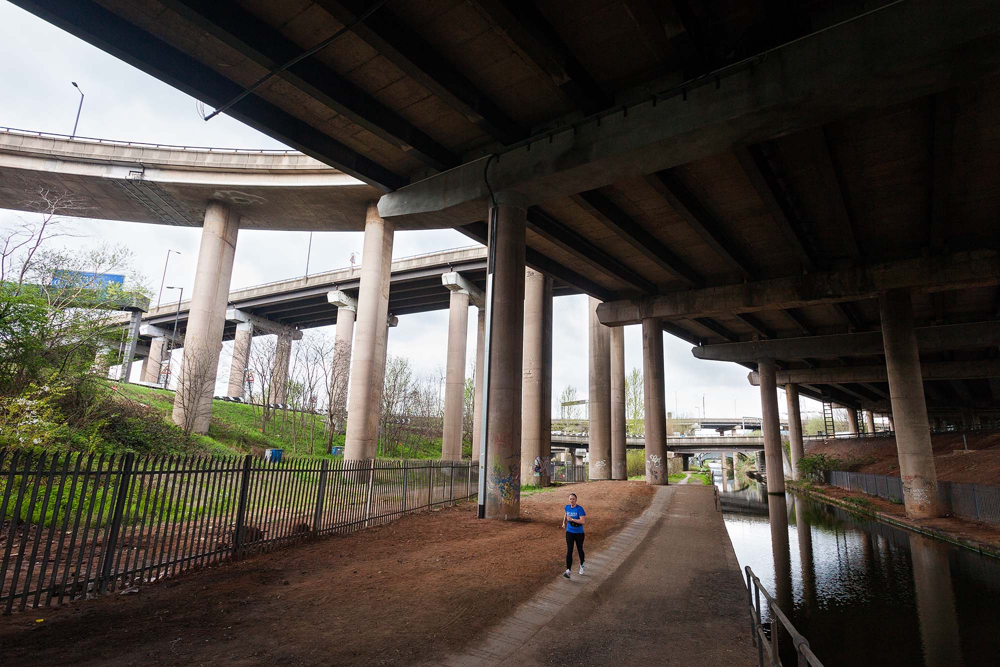 Runner underneath the Gravelly Hill Interchange on the M6 at Birmingham - better known as Spaghetti Junction