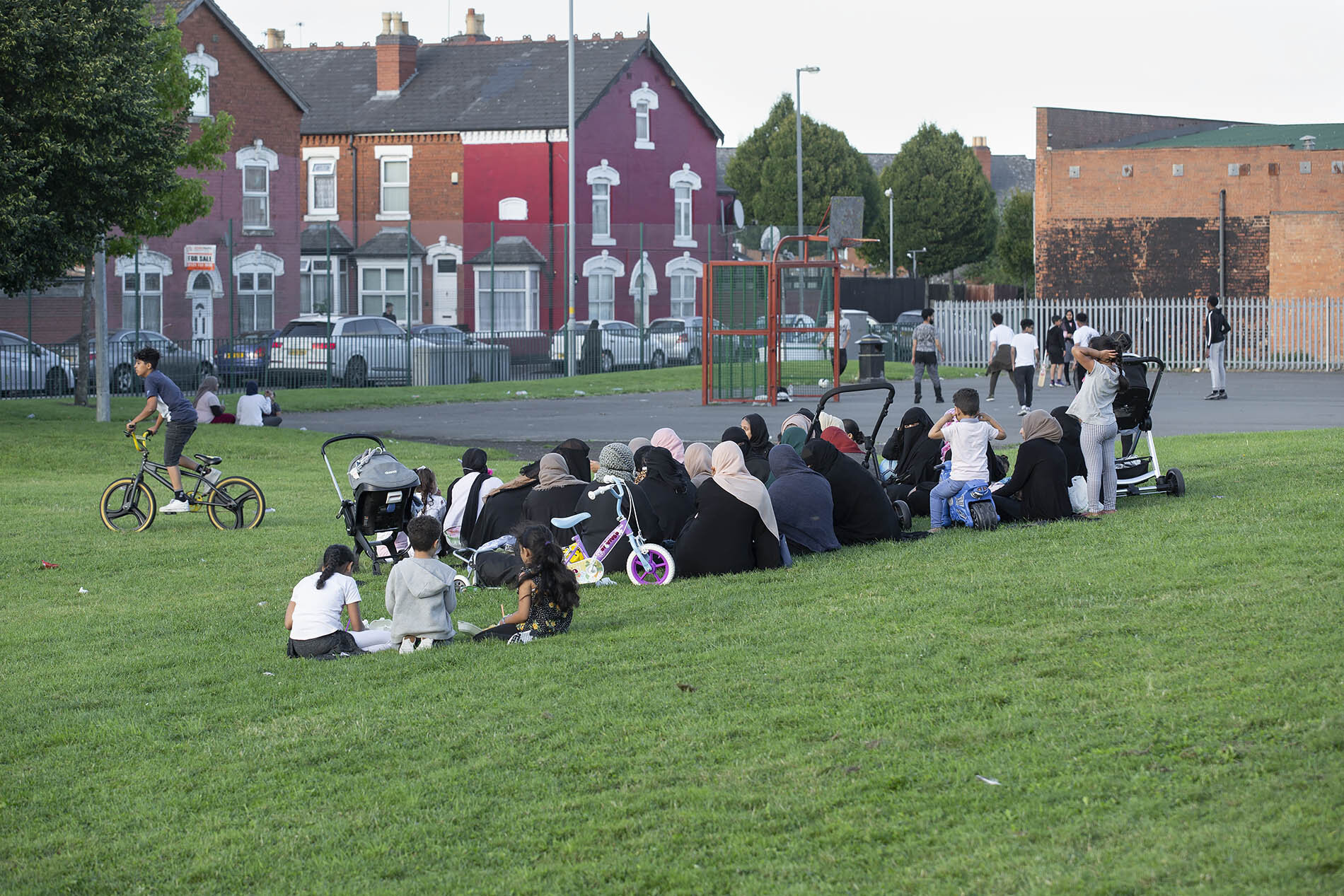 People in a park in the Balsall Heath area of Birmingham. The city has seen a spike in cases of Covid-19.