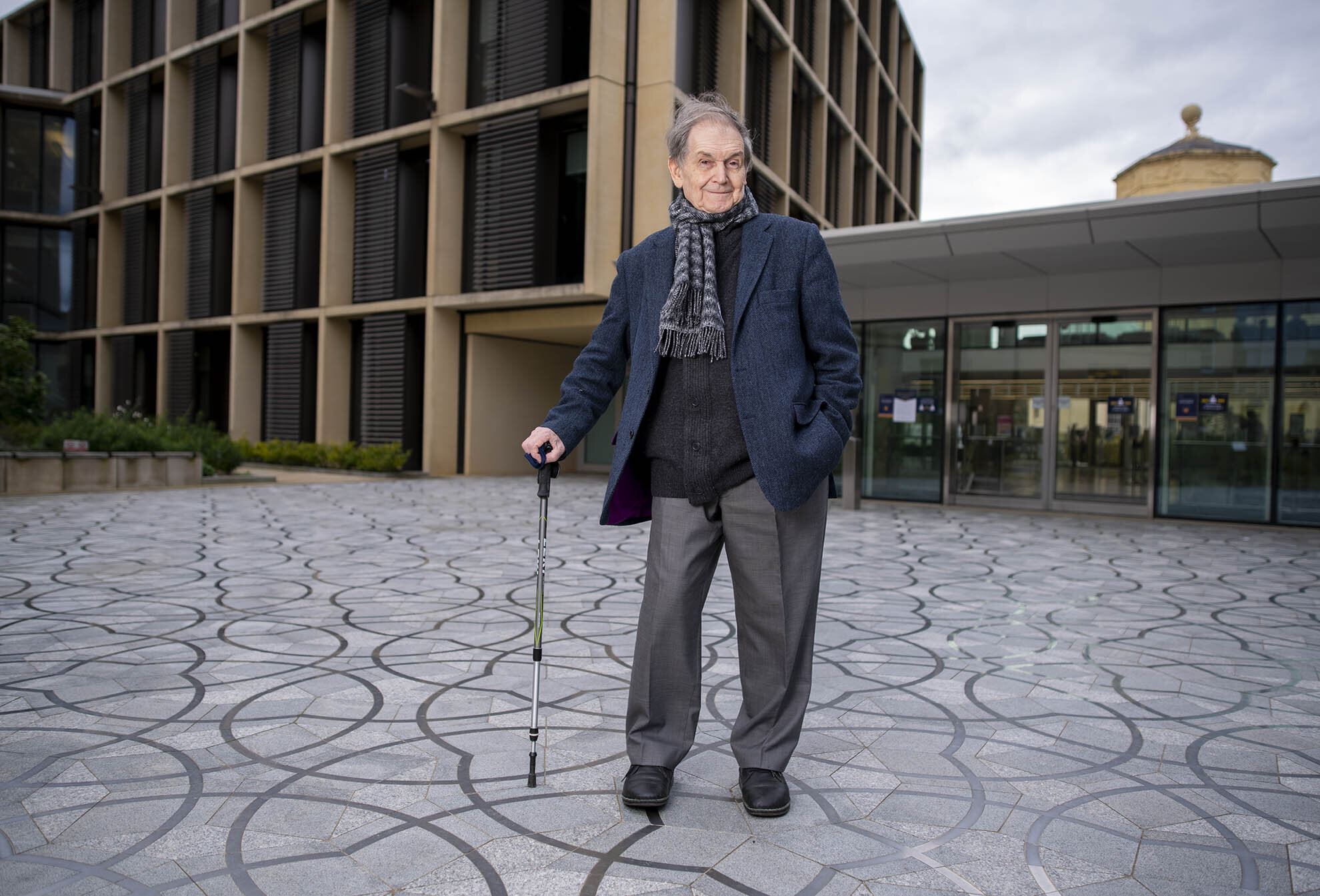 Sir Roger Penrose, Emeritus Professor at the Mathematical Institute of the University of Oxford. He has been awarded the Nobel Prize for Physics. He designed the paving with its non-repetitive pattern in front of this building