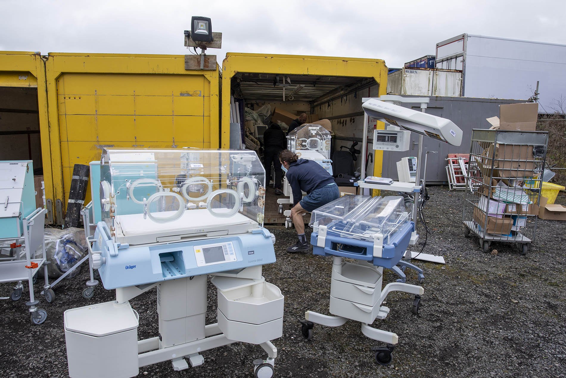 Baby incubators being brought out of storage ready for loading on to an aid convoy going to Ukraine.