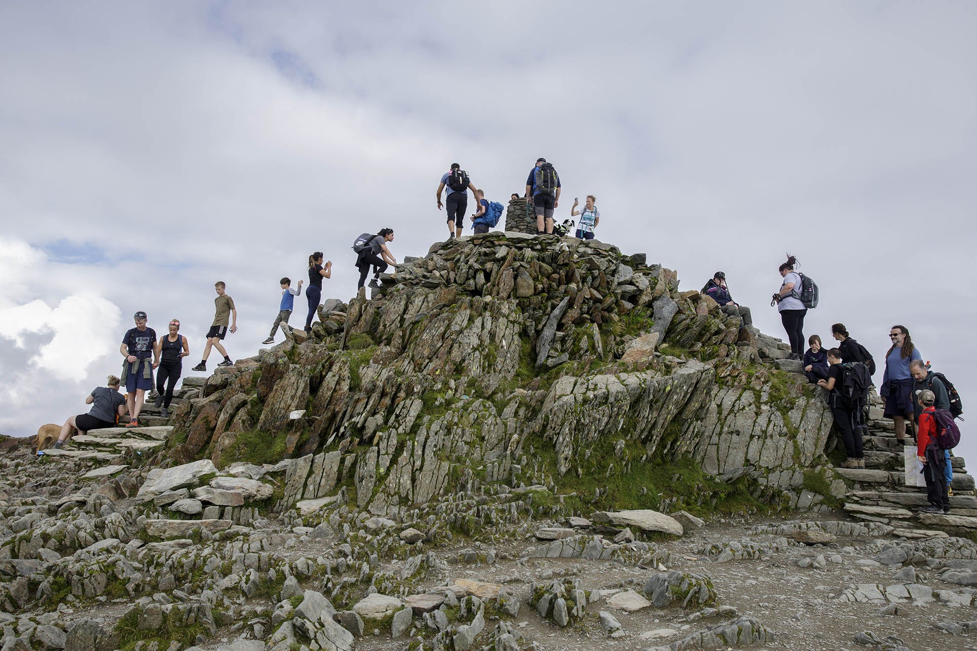  Tourists make their way up the last few metres at the top of Mount Snowdon on the last weekend of the summer holidays. 
