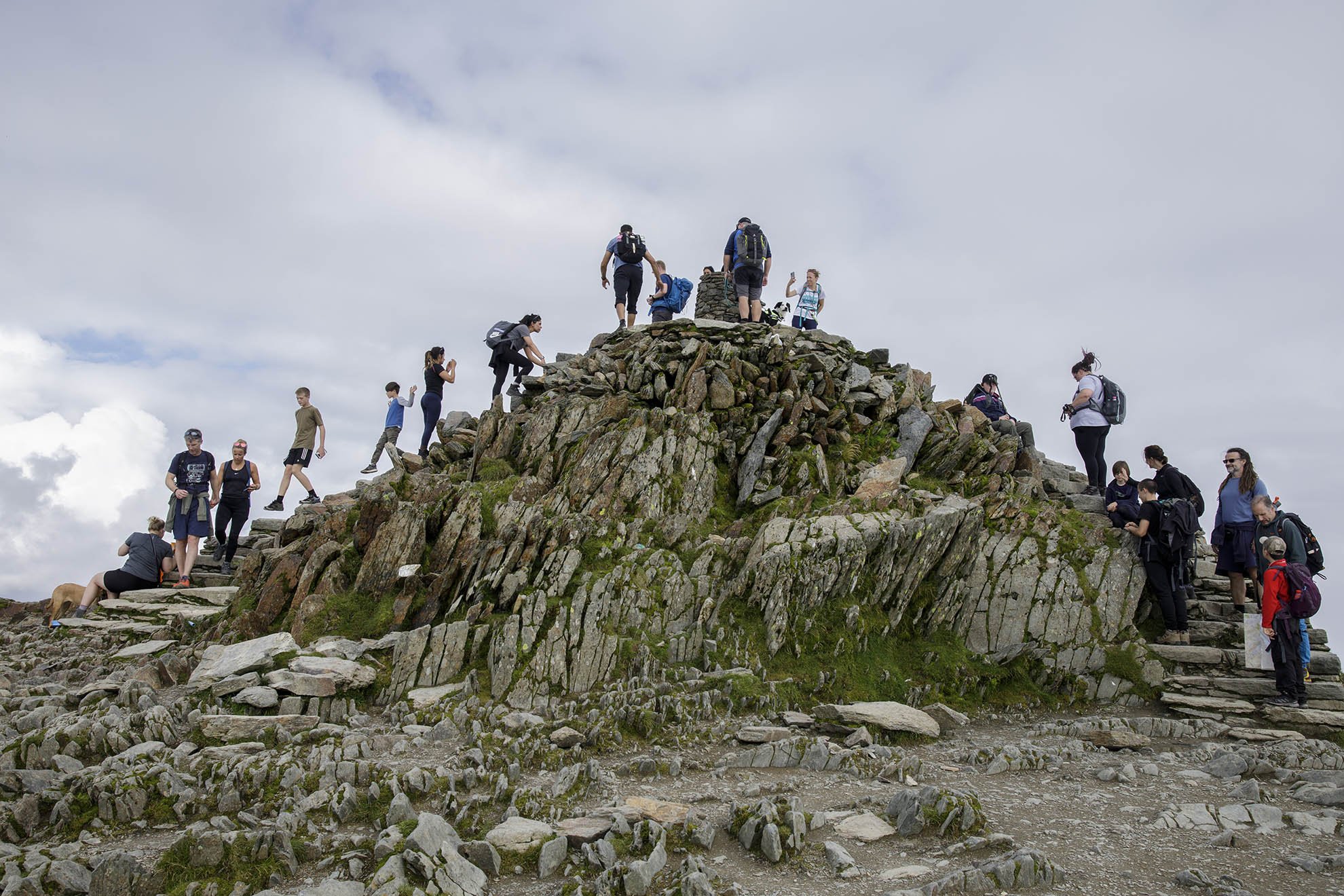 Tourists make their way up the last few metres at the top of Mount Snowdon on the last weekend of the summer holidays.
