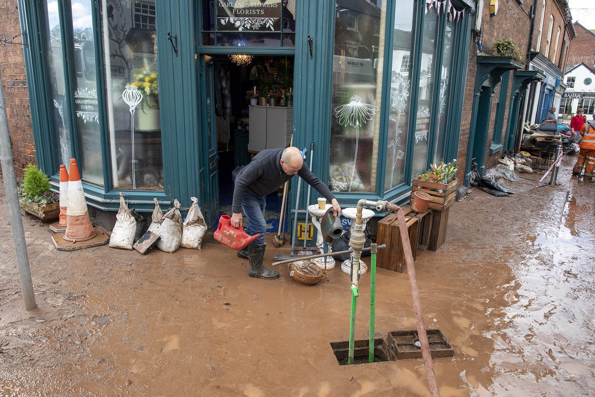 Clearing up after yet more floods in Tenbury Wells, Worcestershire.