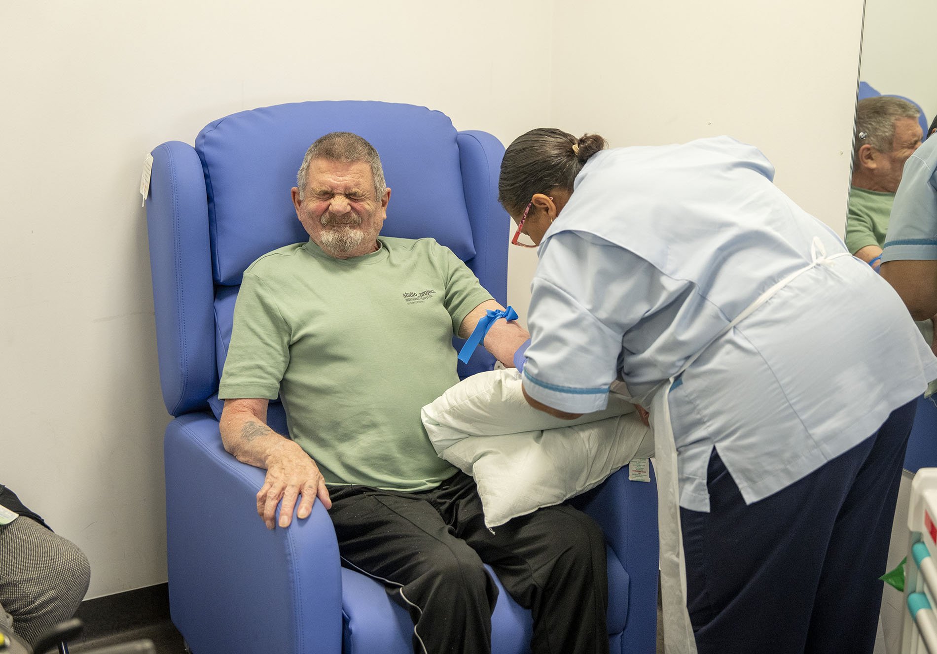 An emphysema patient having blood taken at Washwood Heath Health & Wellbeing Centre in Birmingham. The centre is the first in the UK where GP services sit under the same roof as nursing care and emergency treatment.