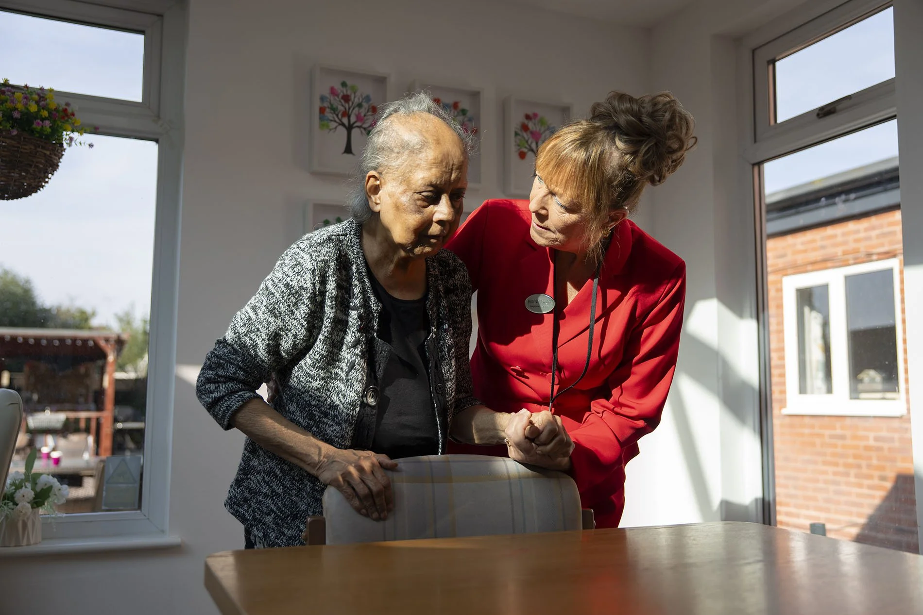  Care home manager Kim Northwood with resident Emma. The home is trying to stay open despite rises in national insurance. 