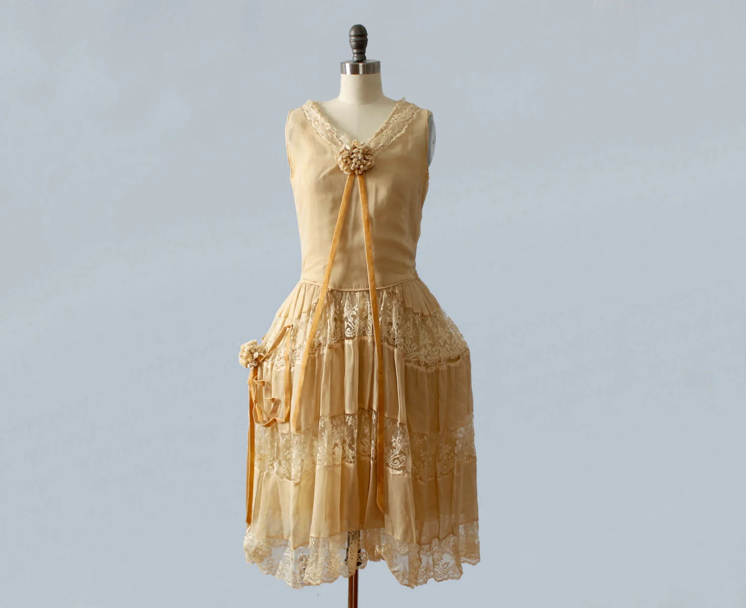 Silk and lace robe de style dress with pannier hoop skirt, flower clusters, and velvet ribbon trim. 1920s.