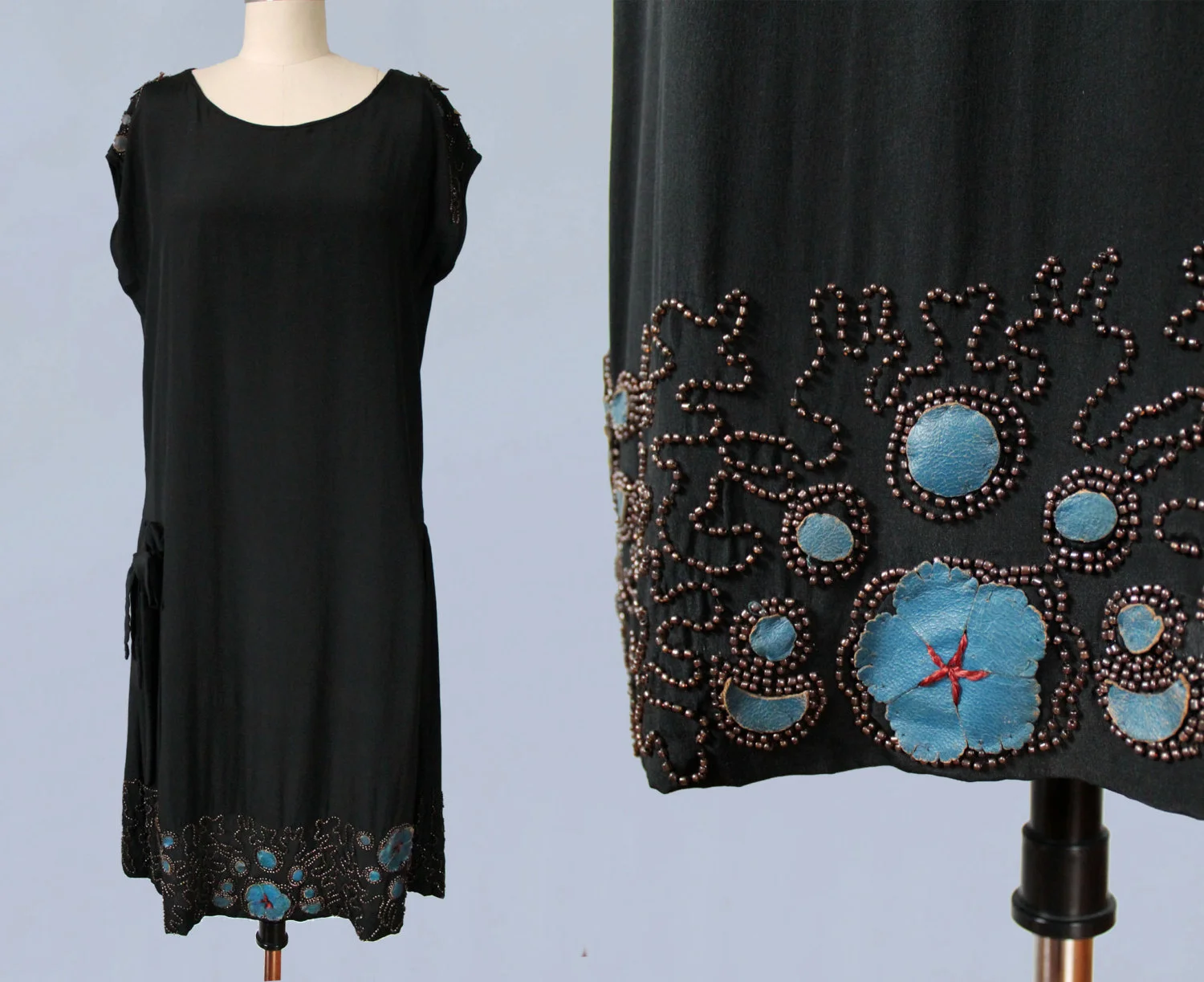 Black silk dress with beading and blue leather applique.