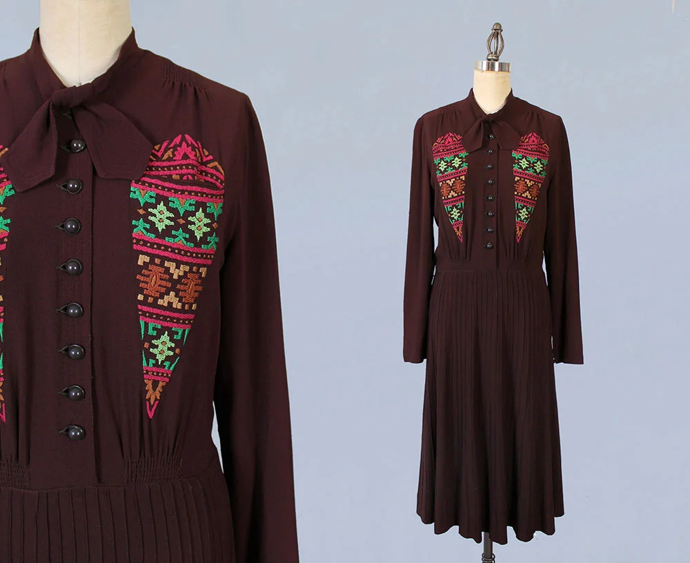 Burgundy crepe dress with diamond embroidered pockets, early 1940s