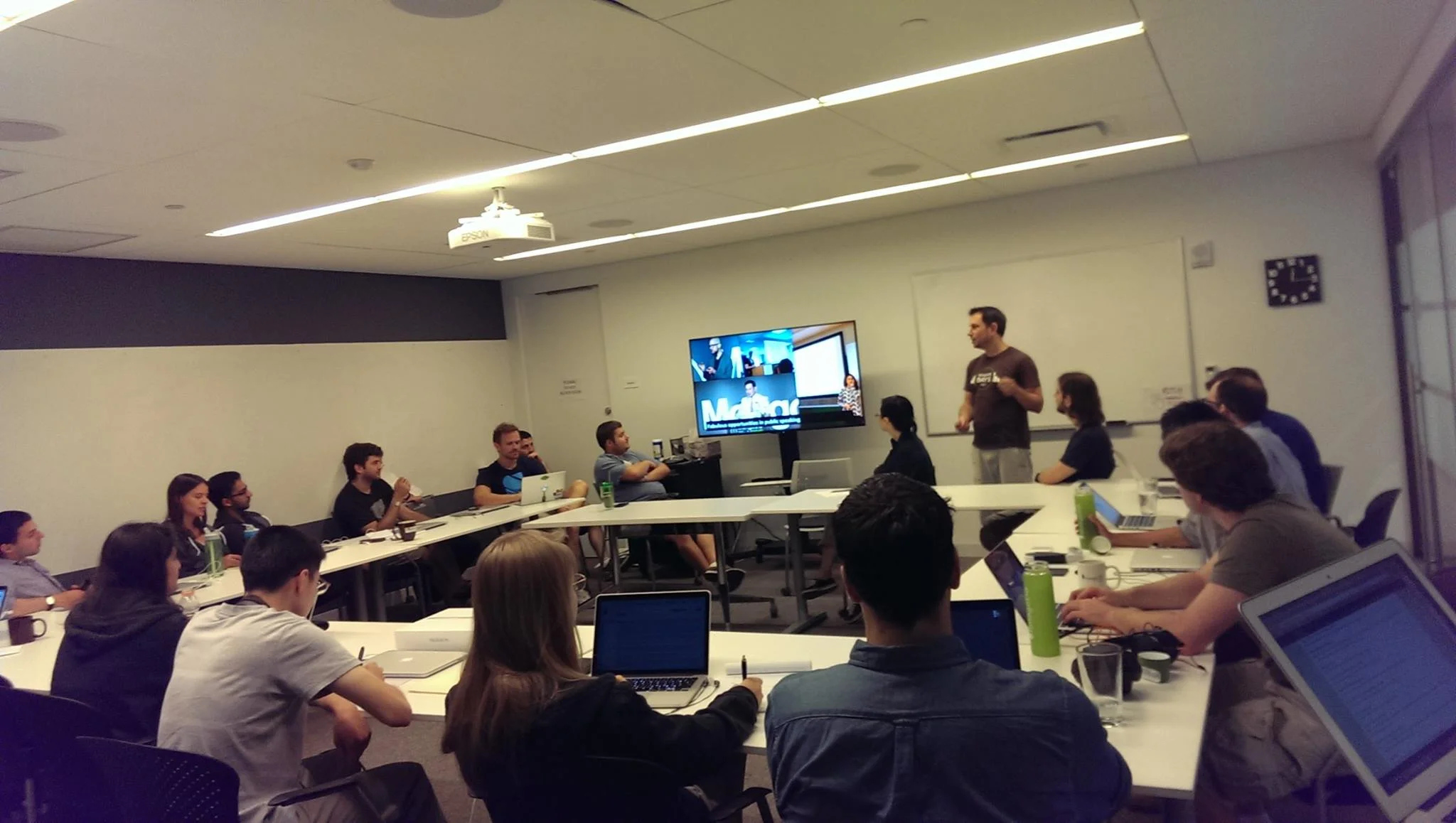Engineers presenting on why New Grads should rotate on their team