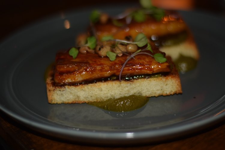 Pork Belly: toast, sorghum glaze, braised collard green puree, black eyed peas