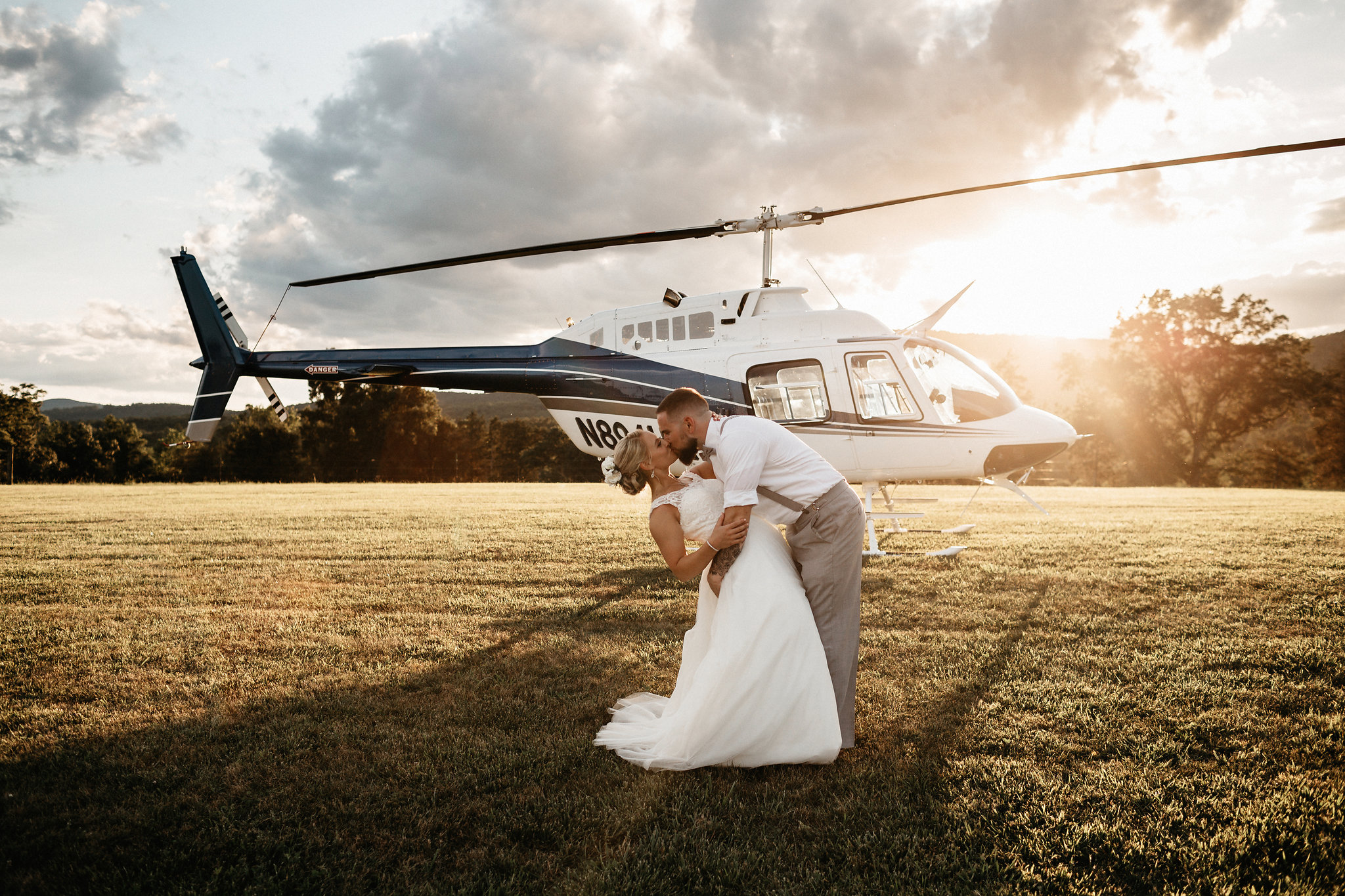 Bethany & Timmy had a super fun wedding at Wolftrap Farm, with a beautiful mountain backdrop for their ceremony and a helicopter exit! Congratulations to the happy couple! Ceremony/Reception ▴ Wolftrap Farm Wedding Coordinator ▴ At Your Service Weddings Florist ▴ Good Earth Flowers Cake ▴ Ali's Little Cake Shop Band ▴ Everwilde DJ ▴ Blue Note DJ Services Catering ▴ Don't Look Back Hair & Makeup Artist ▴ Lou Steven's Glam Squad