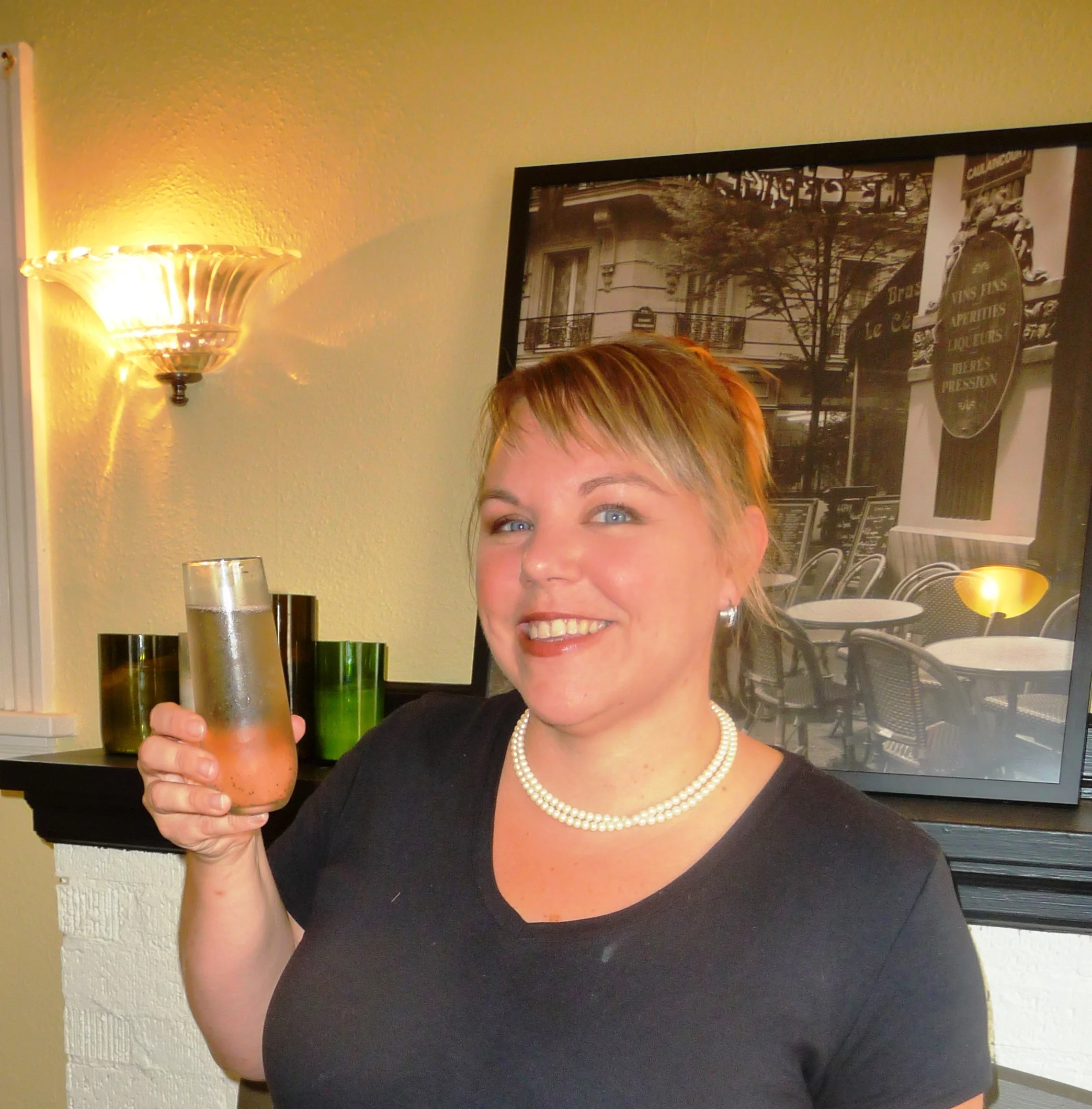 Keri-Gallagher-owner-of-Cest-La-Vie-showing-off-the-Provence-an-elegant-mimosa-made-with-a-Spanish-Cava-and-lavender.jpg