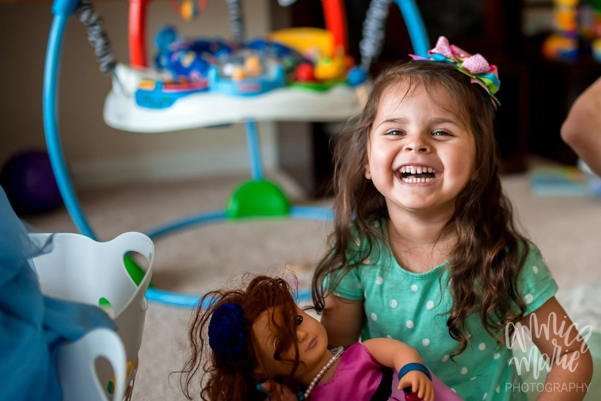 toddler laughing and playing
