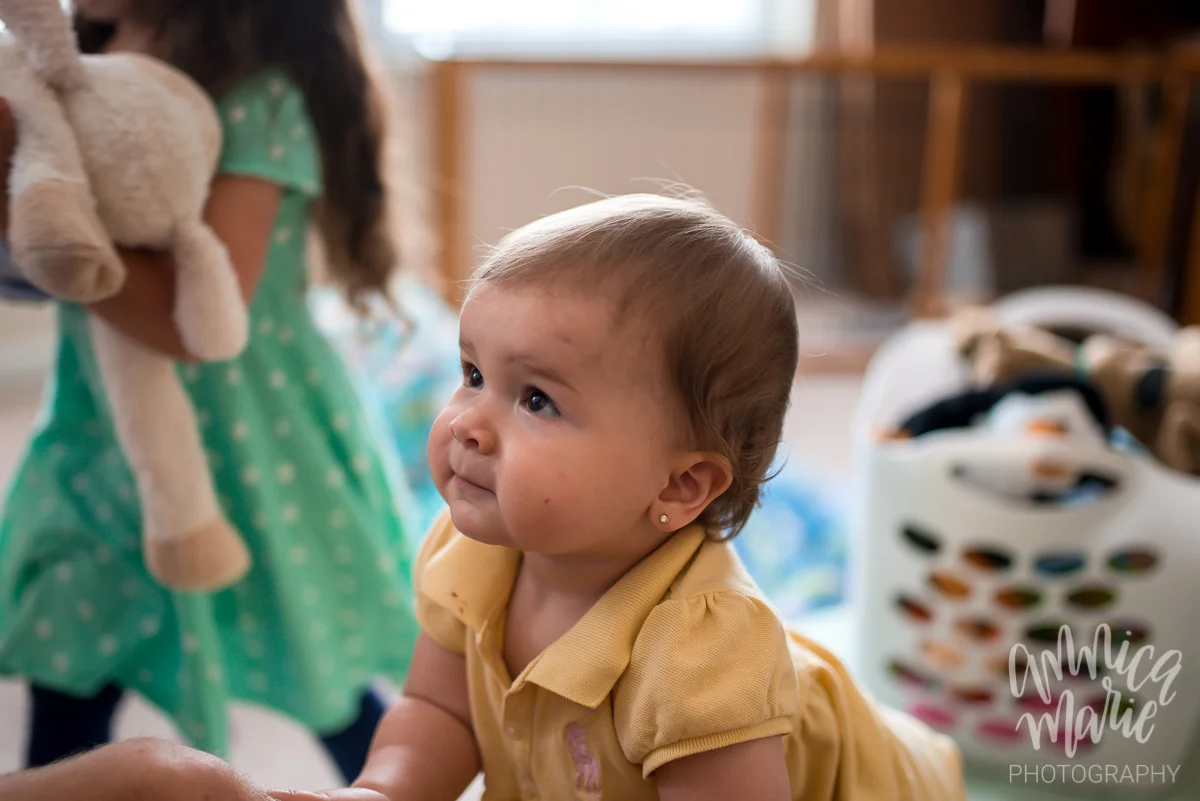 baby staring up at dad