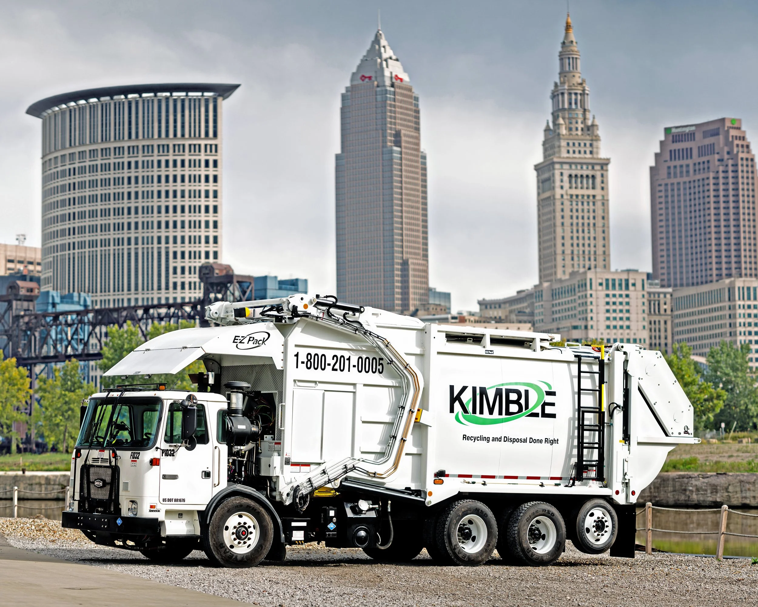 A white recycling collection truck with the KIMBLE.