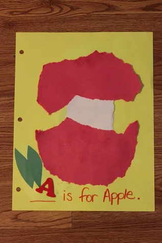 I would make the letter much bigger to make that the focal point. Also, exclude the text, "is for apple". Again, the main focus should be the letter.