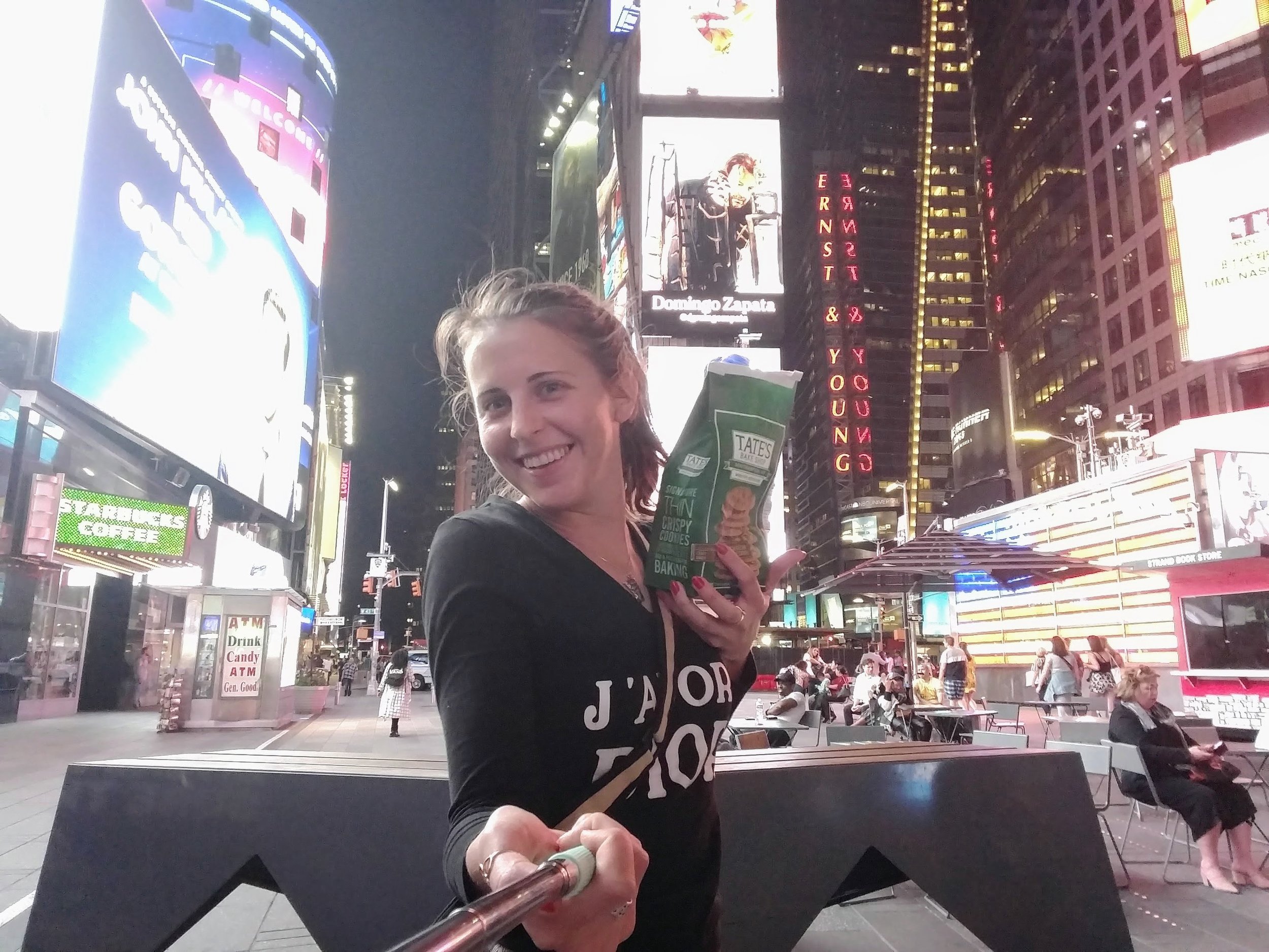 Delivering some cheese featuring a selfie stick, snacks, and Times Square