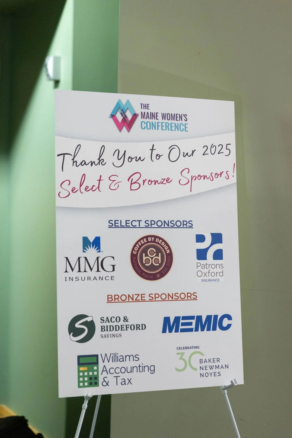 Signage of The Maine Women's Conference 2025 select and bronze sponsors