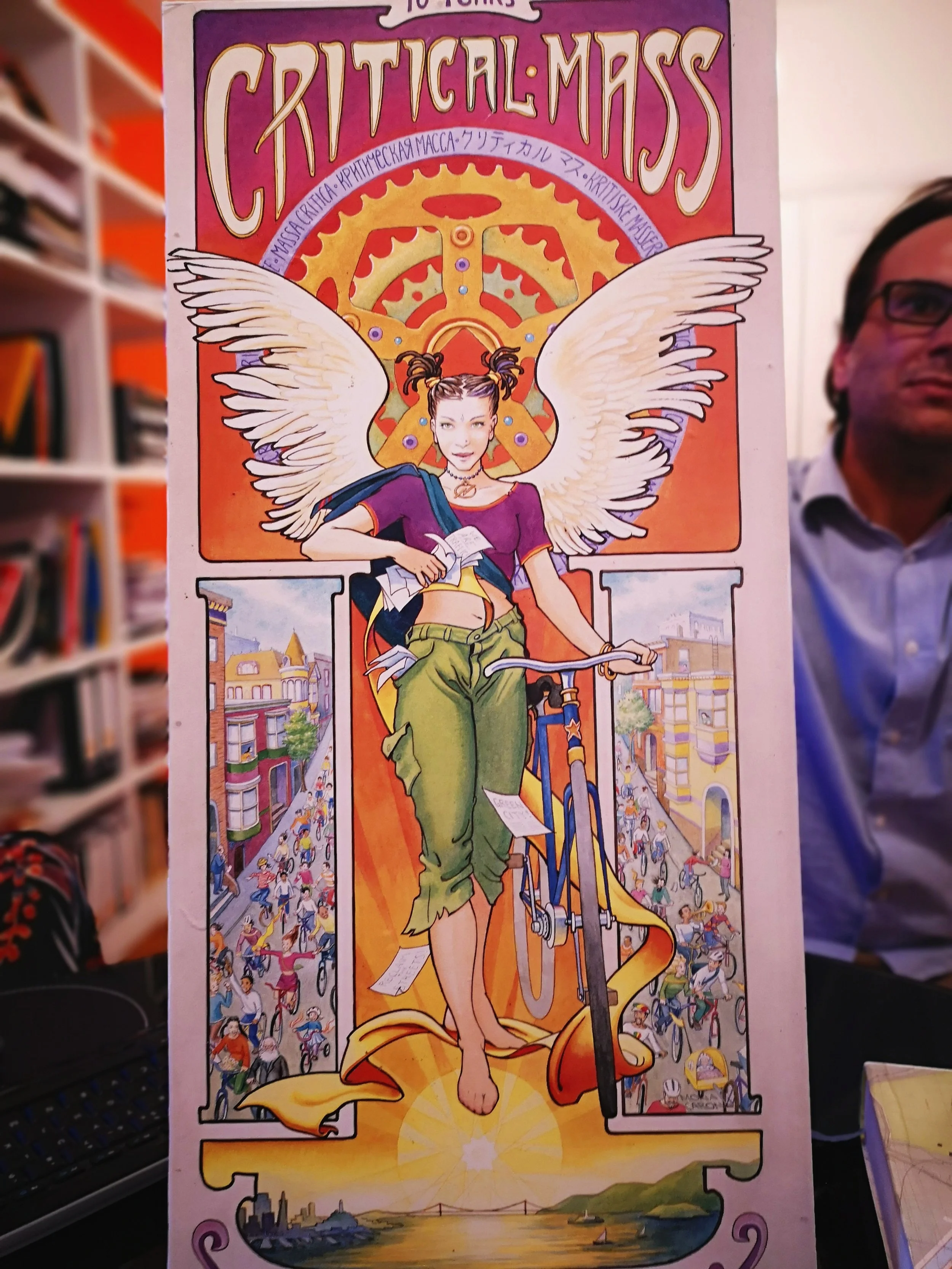Urban planner and social cycling entrepreneur Ricardo Correa shows a poster of Critical Mass .