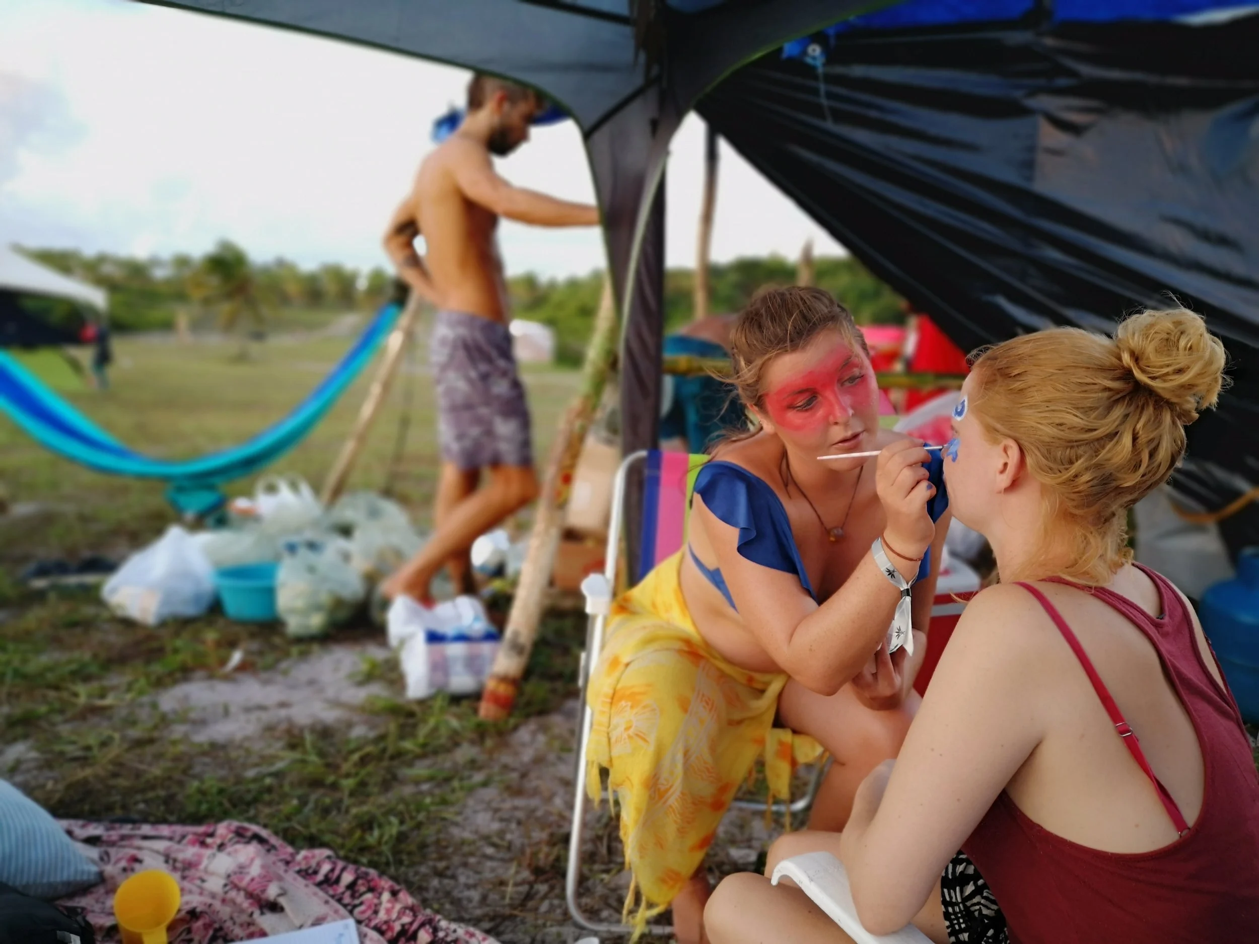 Two Burners are painting faces and getting ready for the party.